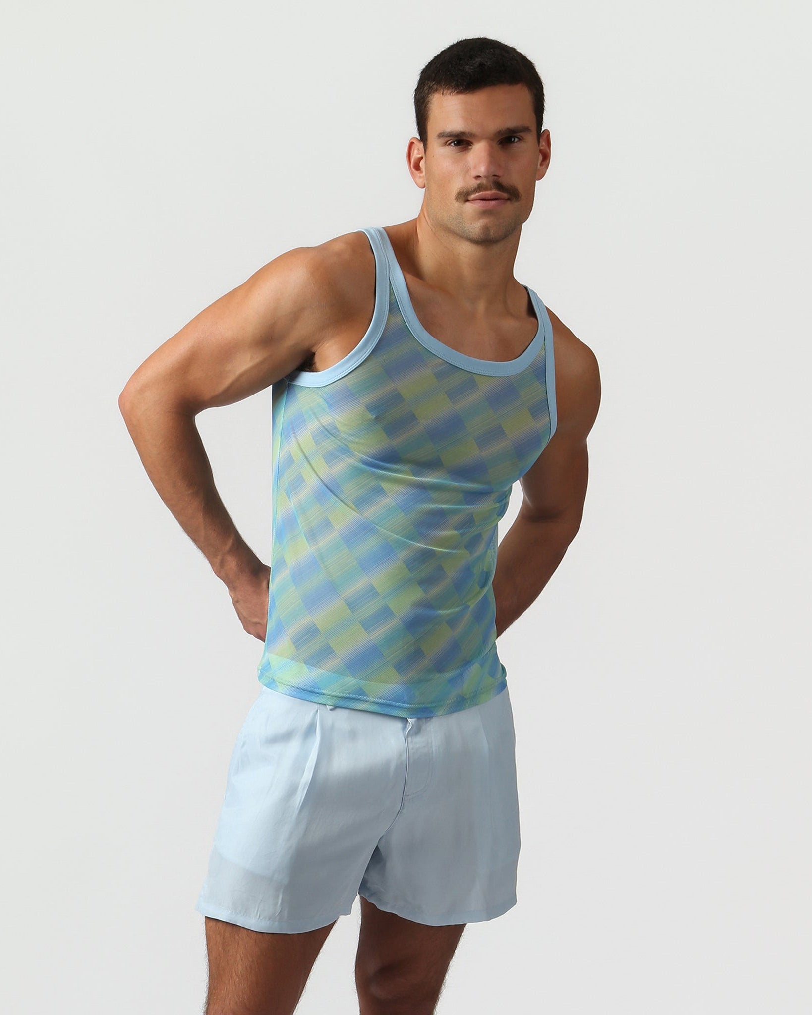 Parke & Ronen Azure Twilo Print Mesh Roxy Tank Azure — men's mesh tank on model, front view