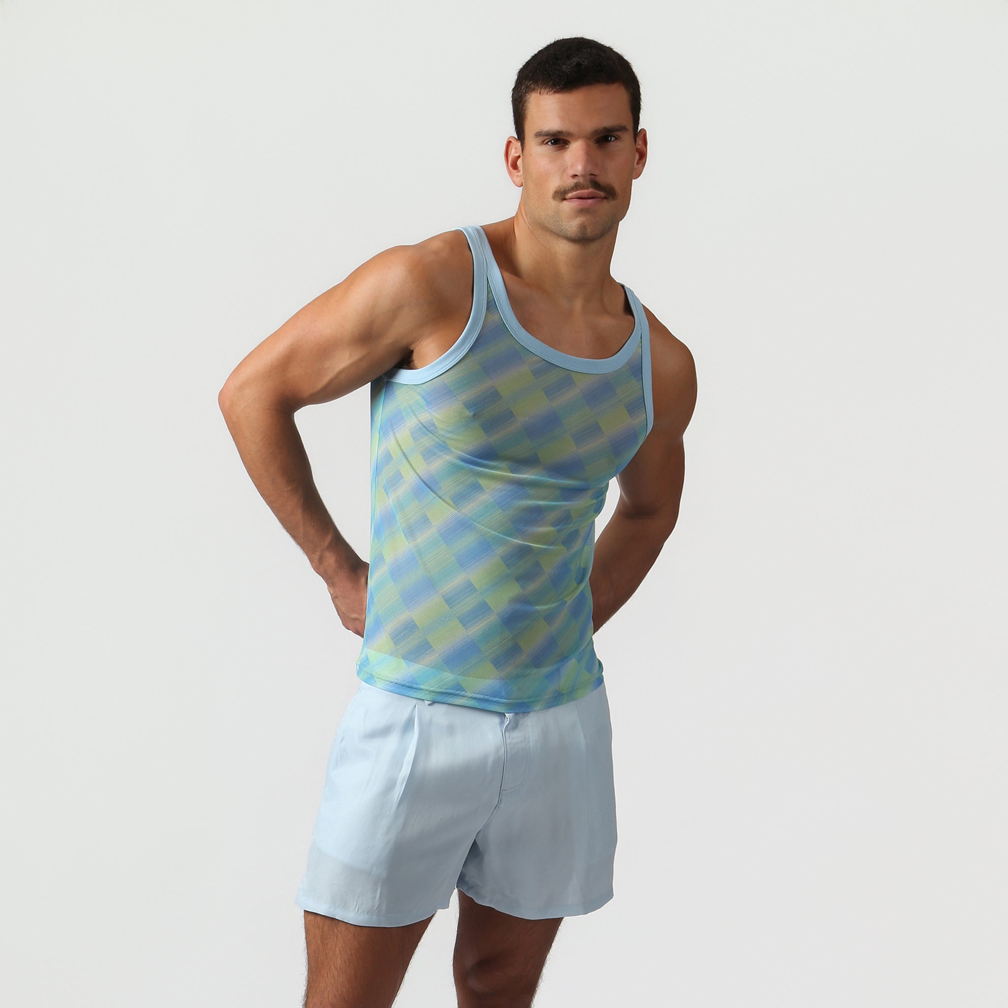 Parke & Ronen Azure Twilo Print Mesh Roxy Tank Azure — men's mesh tank on model, front view