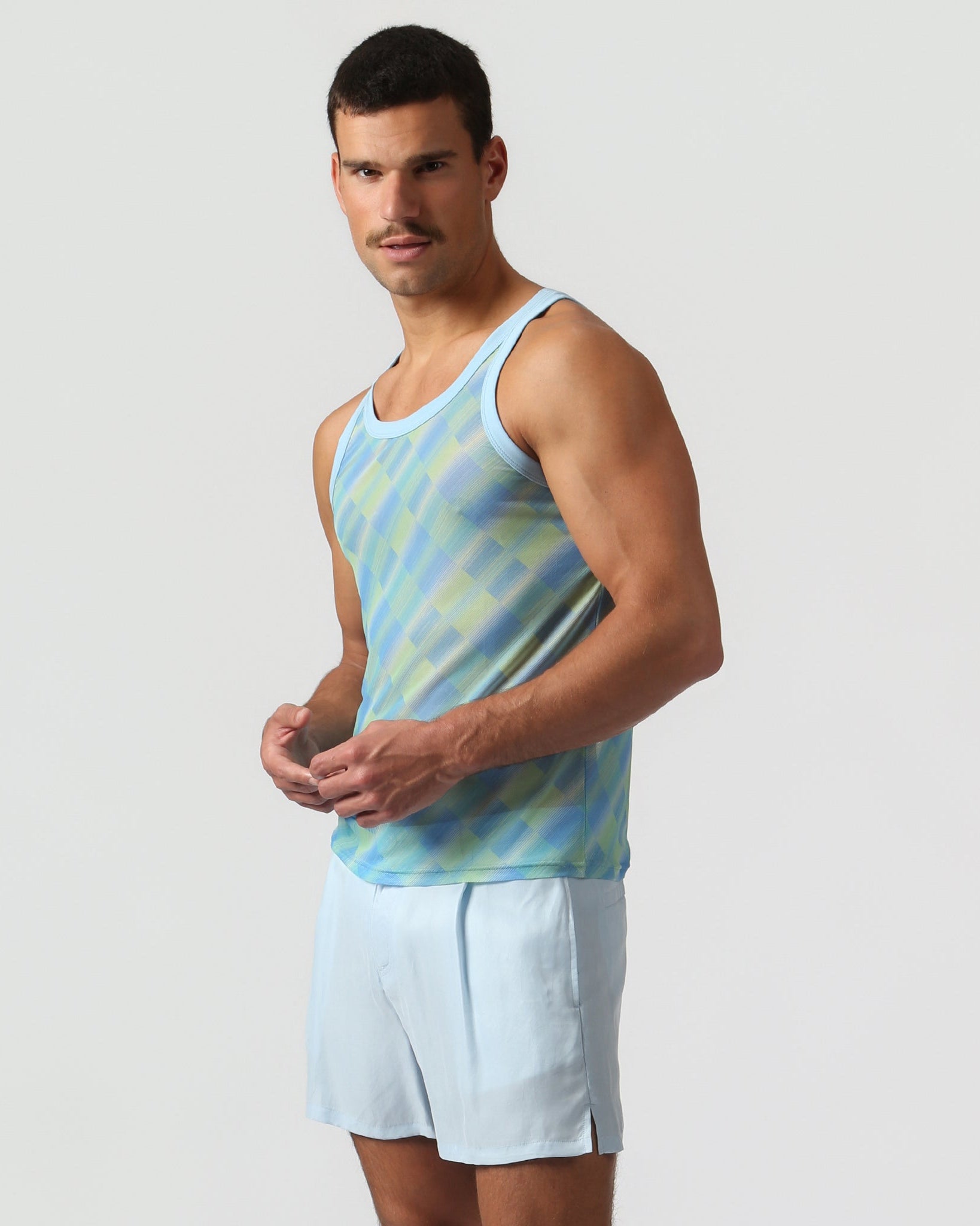 Parke & Ronen Azure Twilo Print Mesh Roxy Tank Azure — men's mesh Roxy tank on model, side view