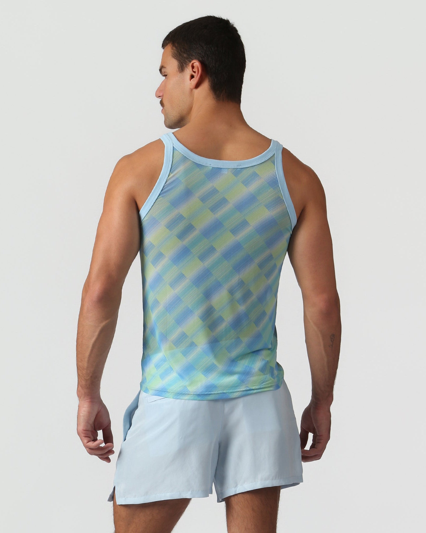 Parke & Ronen Azure Twilo Print Mesh Roxy Tank Azure — men's mesh tank on model, back view