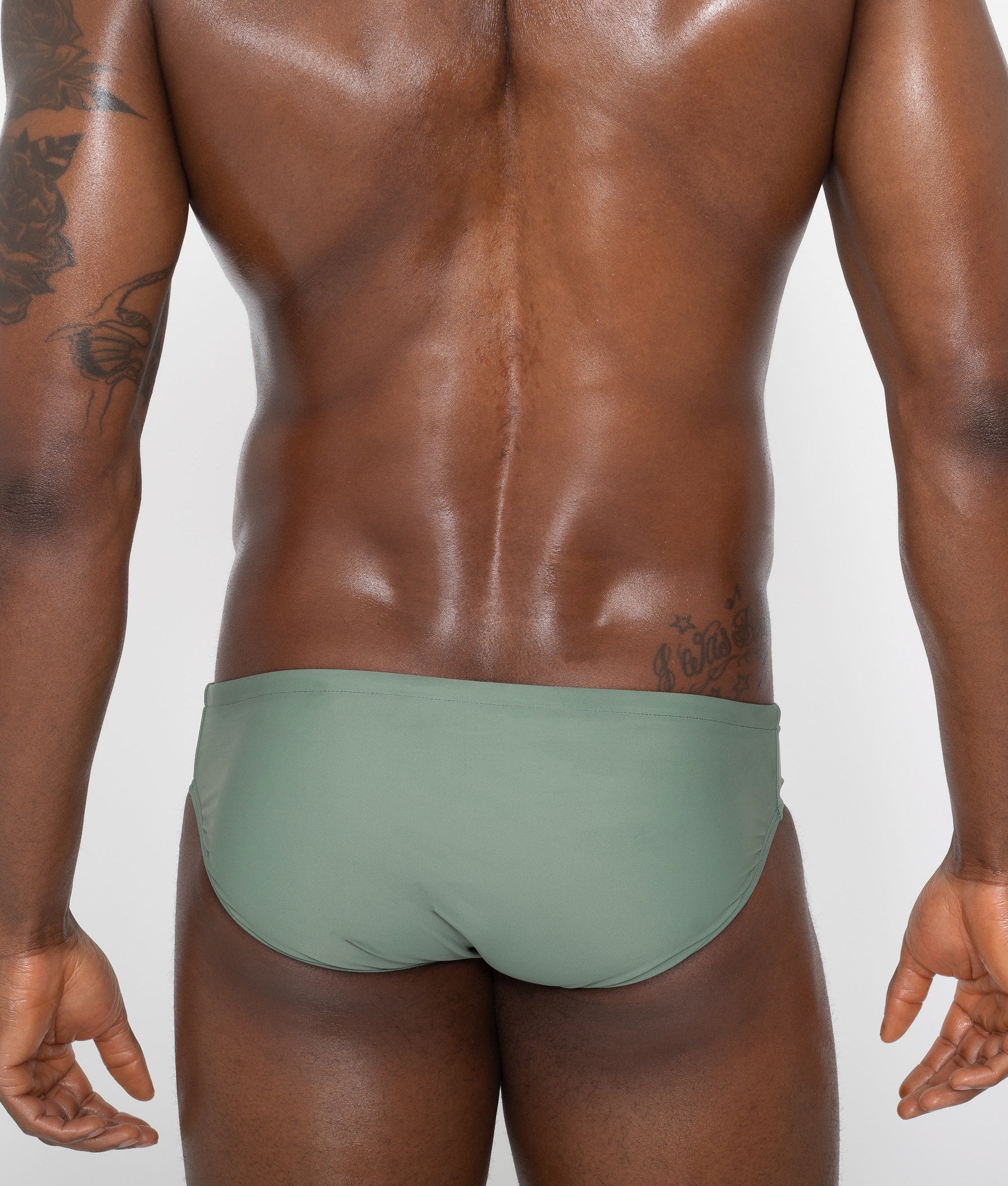 Sean & Val Classic Brief Sage — men's swim brief back view showing minimal coverage