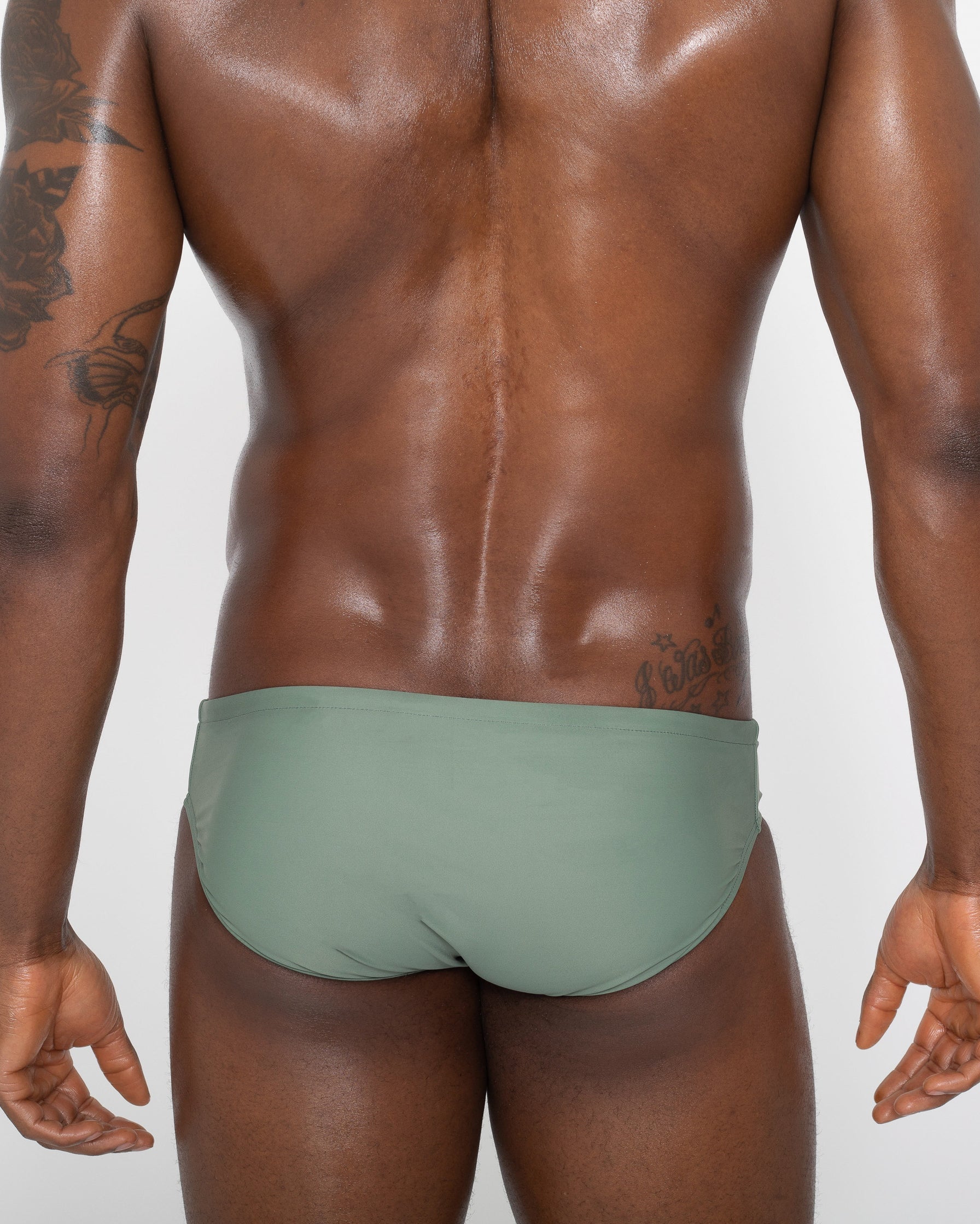 Sean & Val Classic Brief Sage — men's swim brief back view showing minimal coverage