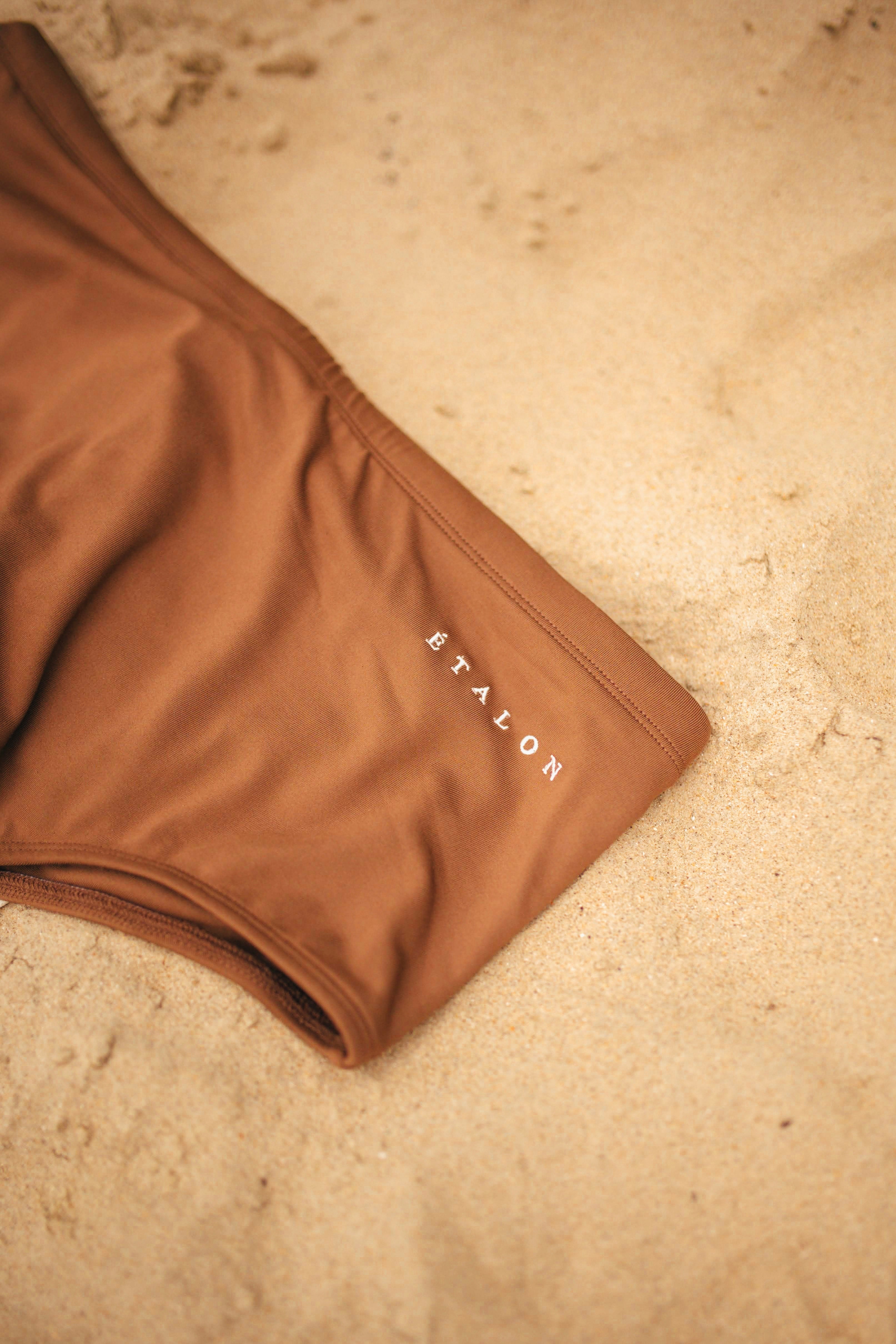 Étalon Brown Swim Sunga - men's swim brief action shot by water