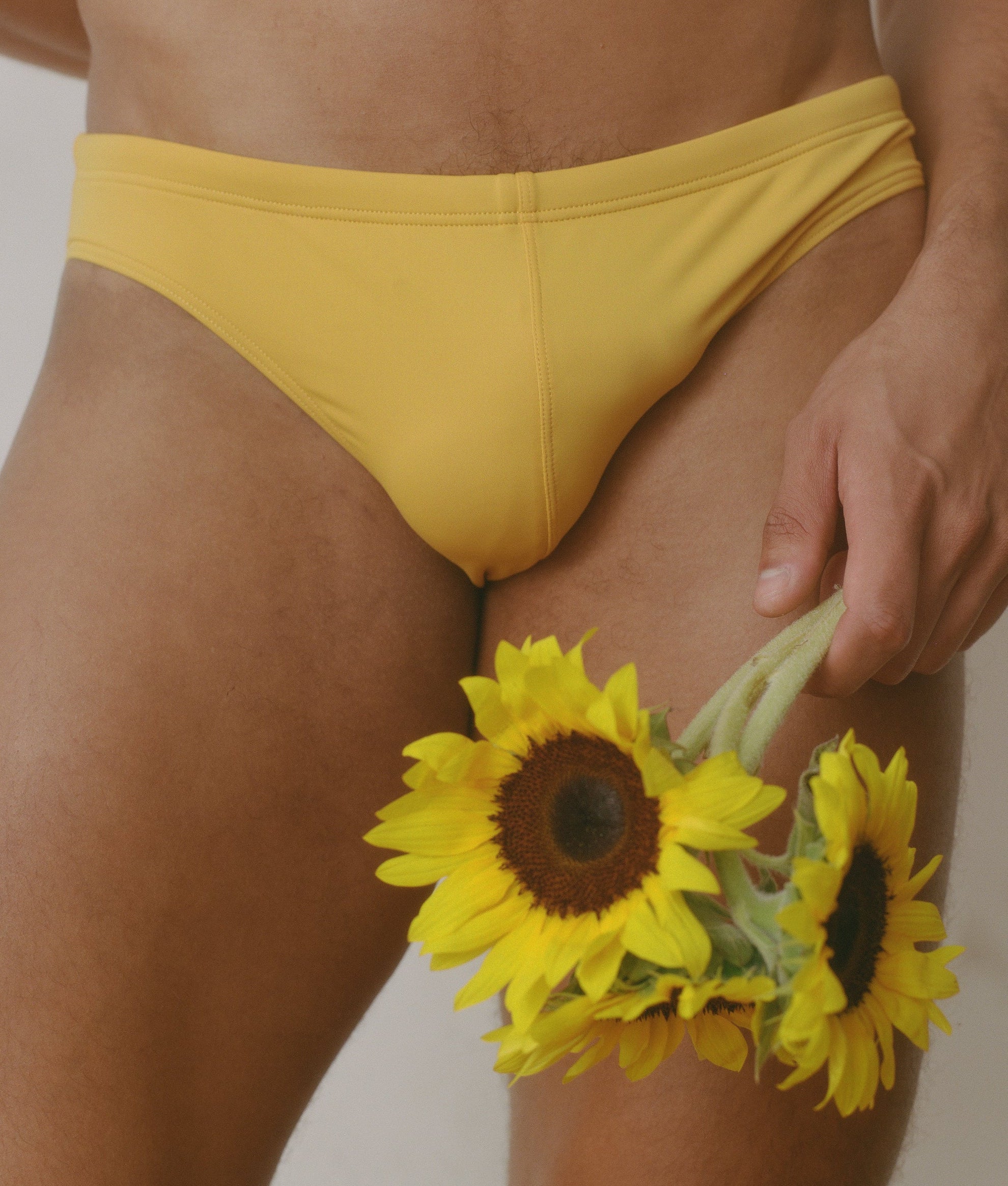 Sean & Val Racer Brief Sunflower — men's minimal swim brief, model front close-up