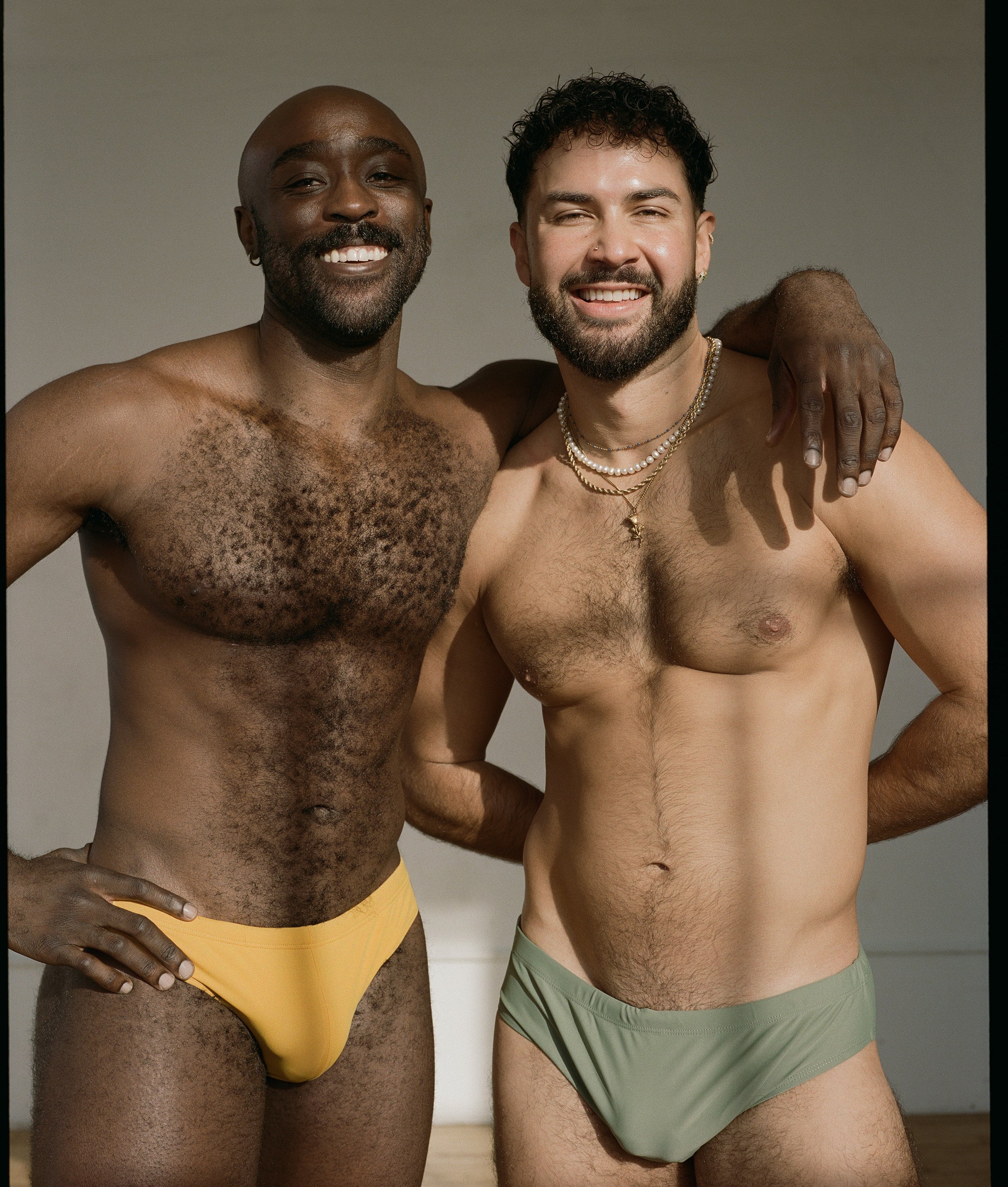 Sean & Val Racer Brief Sunflower — men's swim brief worn in group lifestyle shot