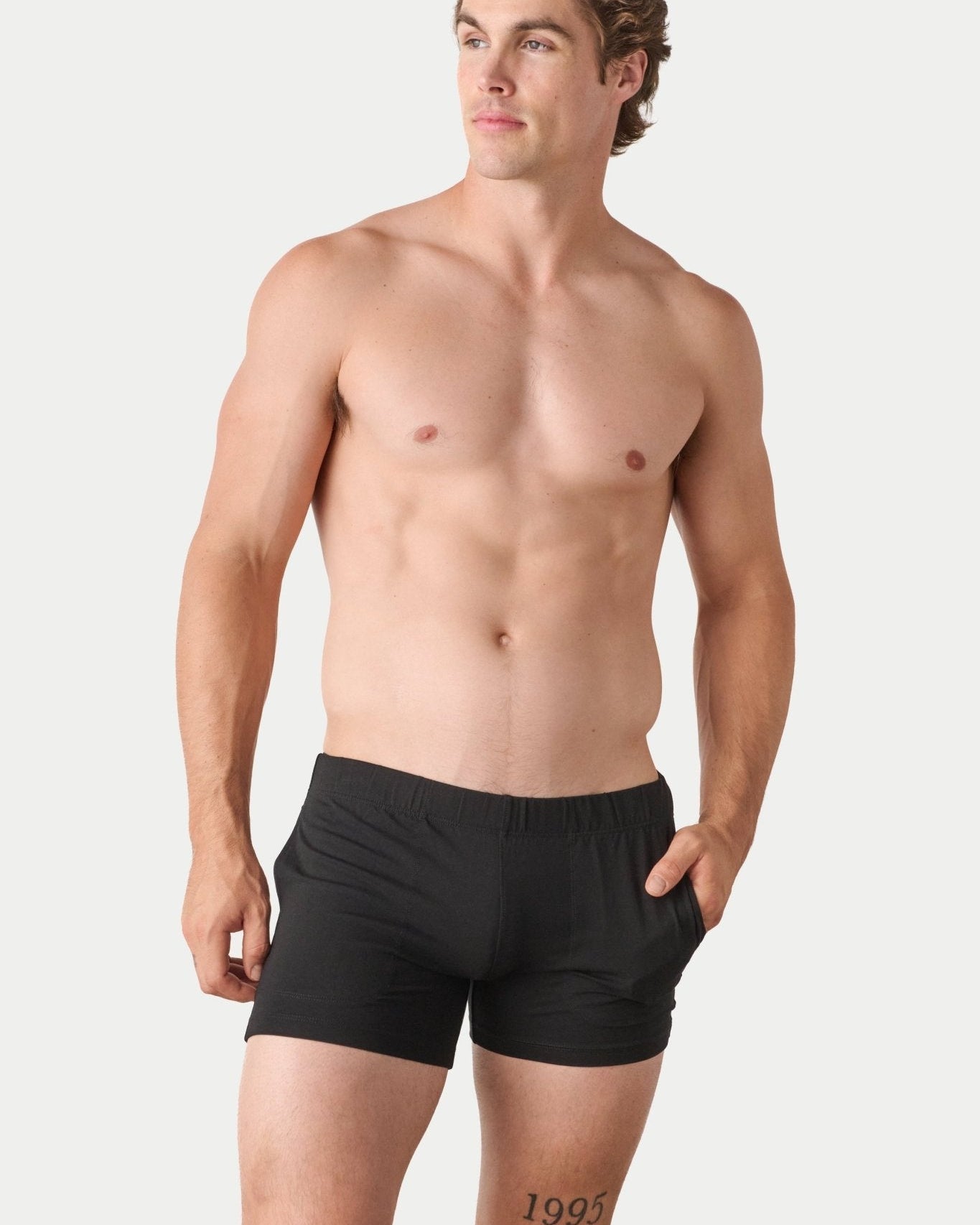 Awry Flow 4 Inch Short V2 Black — close-up of bamboo-cotton fabric texture and form-fitting leg opening
