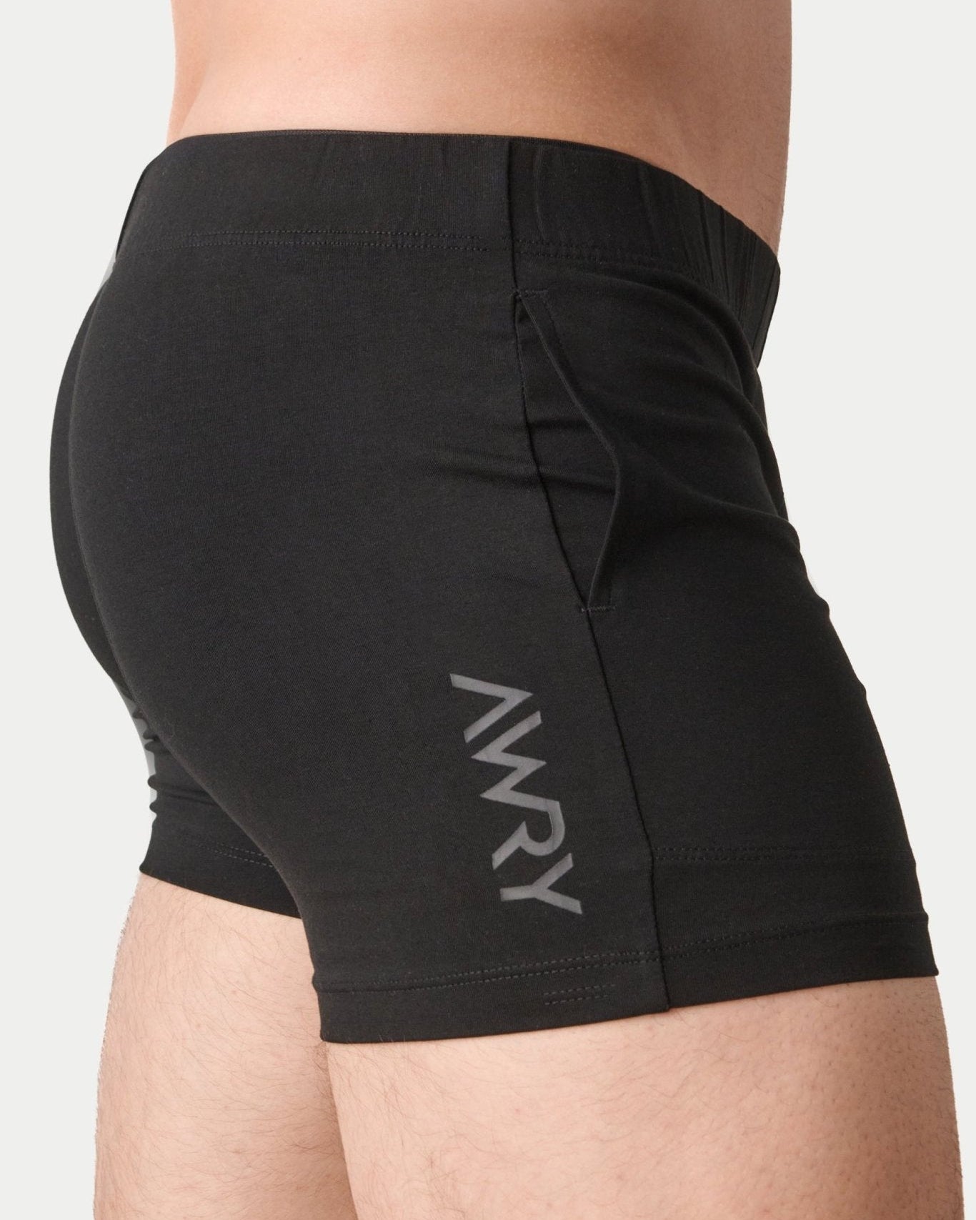 Awry Flow 4 Inch Short V2 Black — rear view showing extra-high inseam and glute-sculpting cut