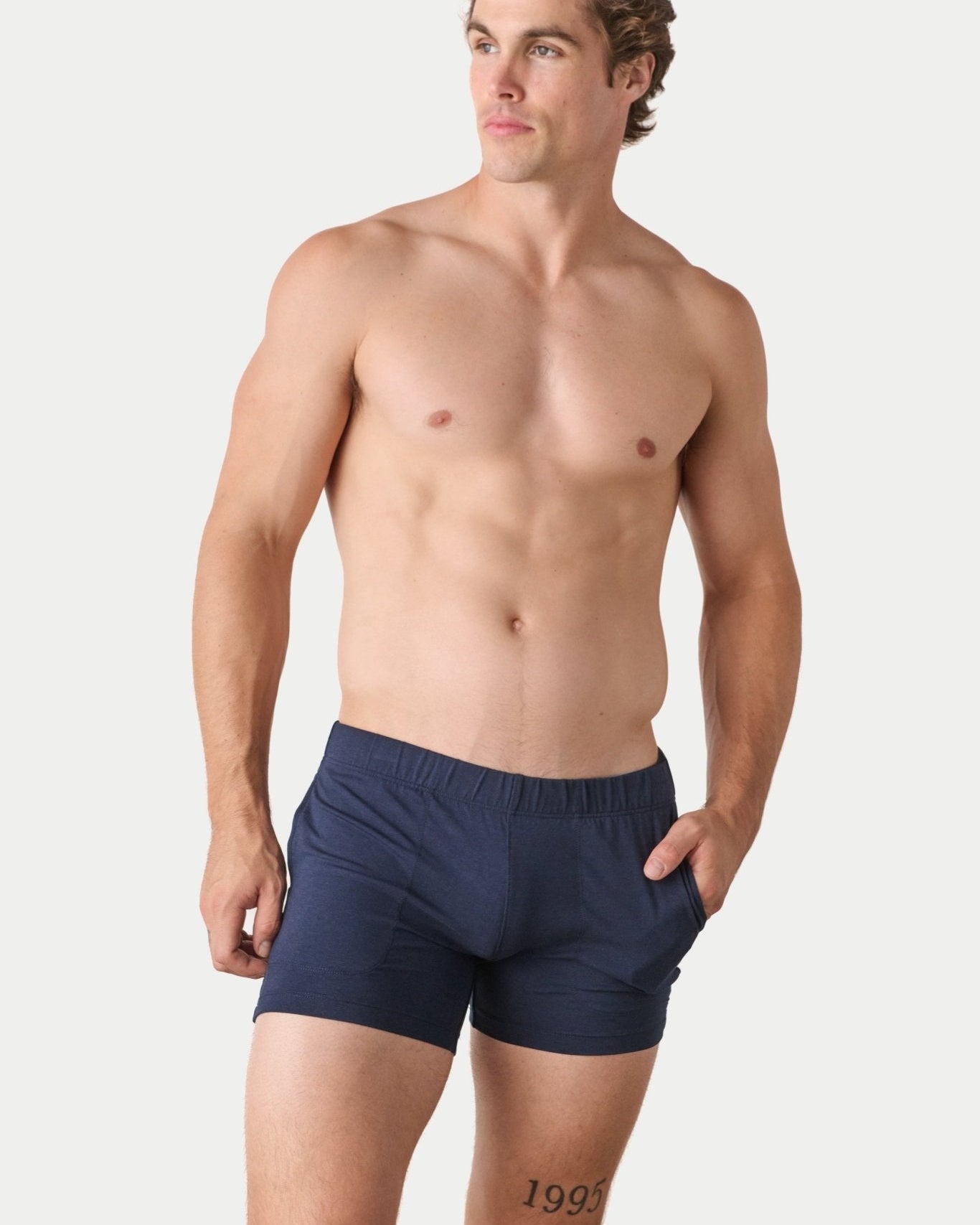 Awry Flow 4 Inch Short V2 Navy — close-up of bamboo-cotton fabric texture and form-fitting leg opening