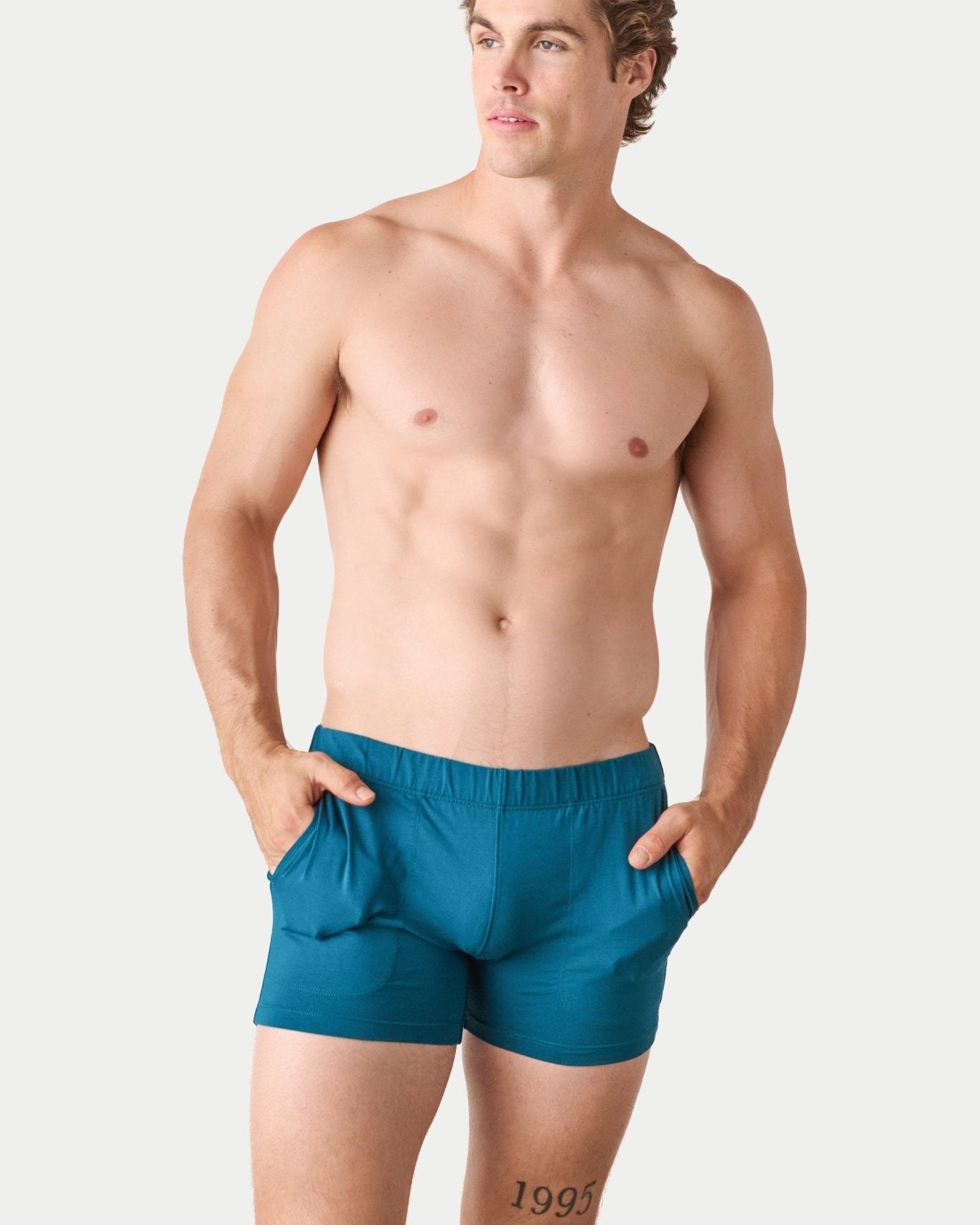 Awry Flow 4 Inch Short V2 Teal — close-up of bamboo-cotton fabric texture and form-fitting leg opening