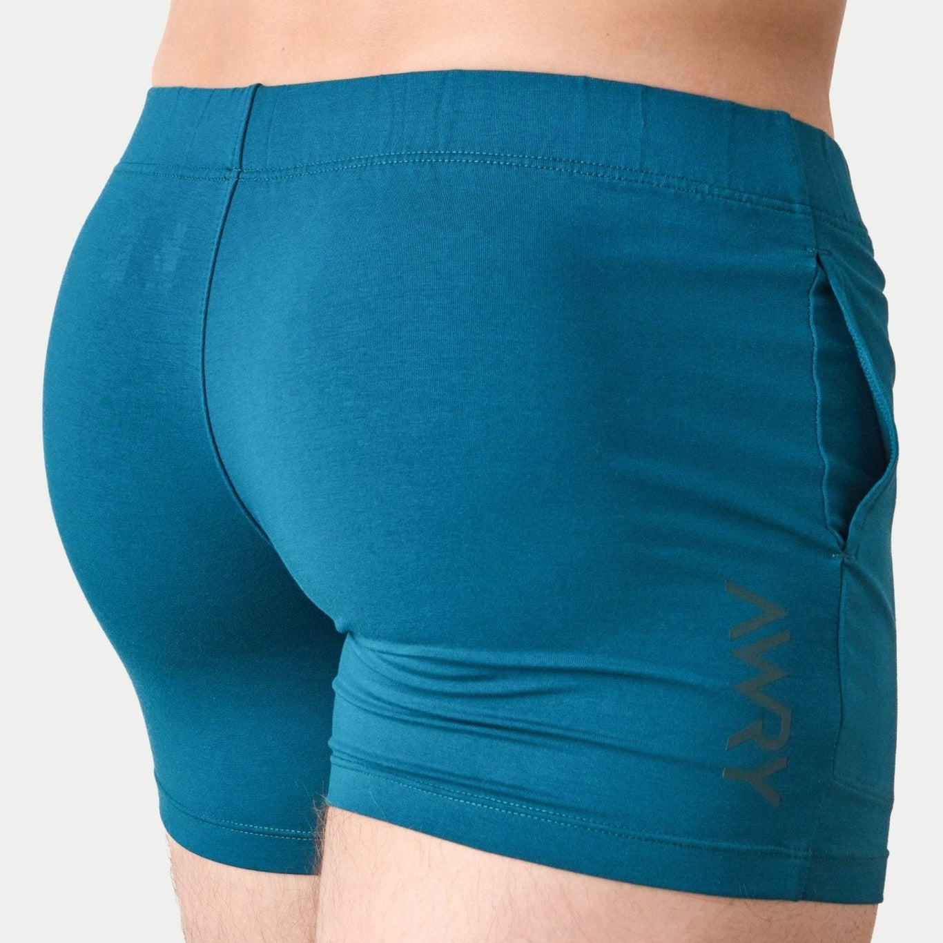 Awry Flow 4 Inch Short V2 Teal — rear view showing extra-high inseam and glute-sculpting cut