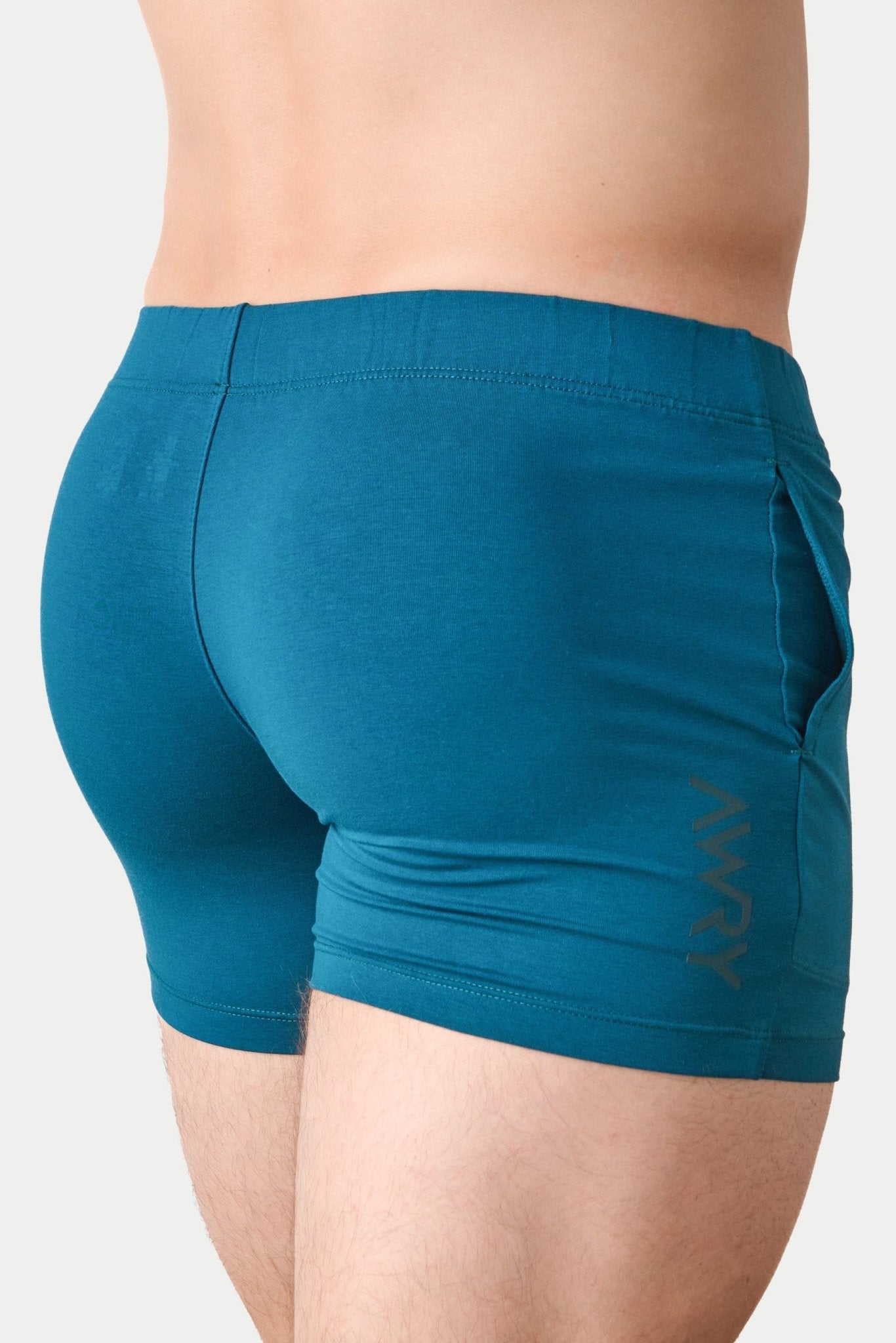 Awry Flow 4 Inch Short V2 Teal — rear view showing extra-high inseam and glute-sculpting cut