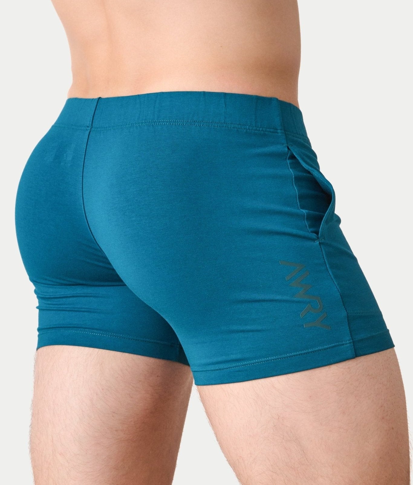 Awry Flow 4 Inch Short V2 Teal — side view showing roomy front pocket and smooth waistband