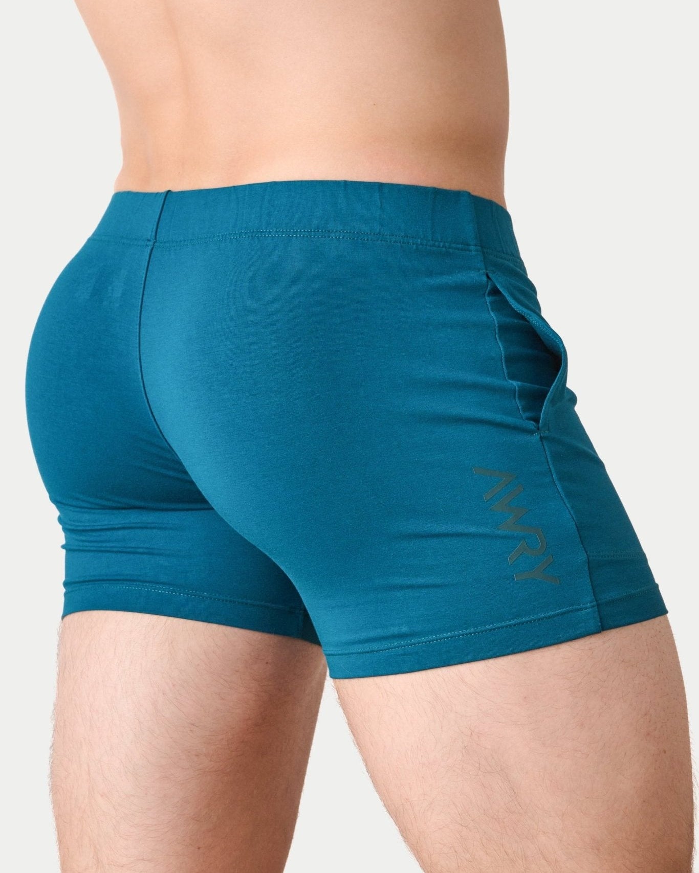 Awry Flow 4 Inch Short V2 Teal — side view showing roomy front pocket and smooth waistband