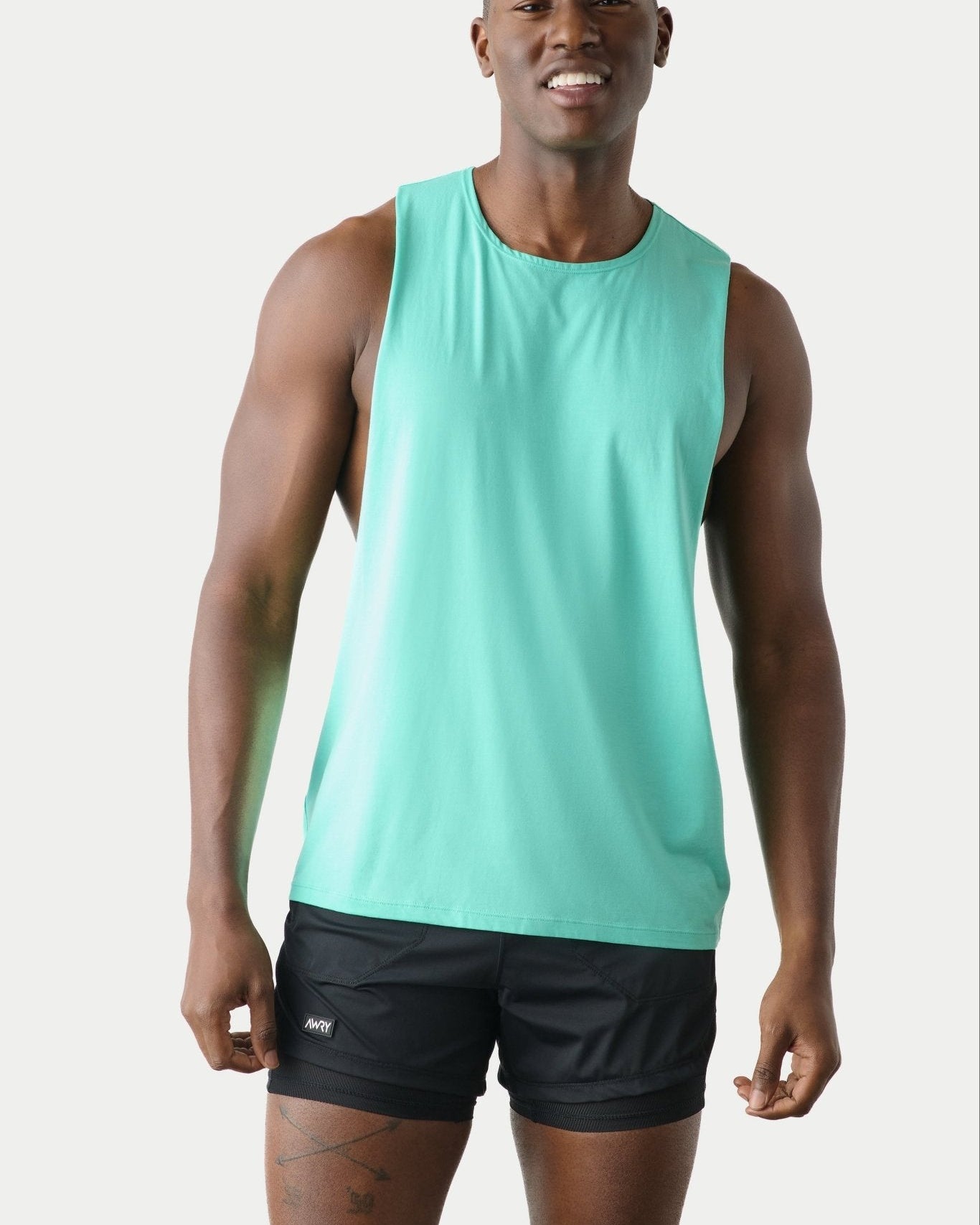 Awry Impact Tank Turquoise — men's cotton-modal activewear tank with deep side cutouts, front view