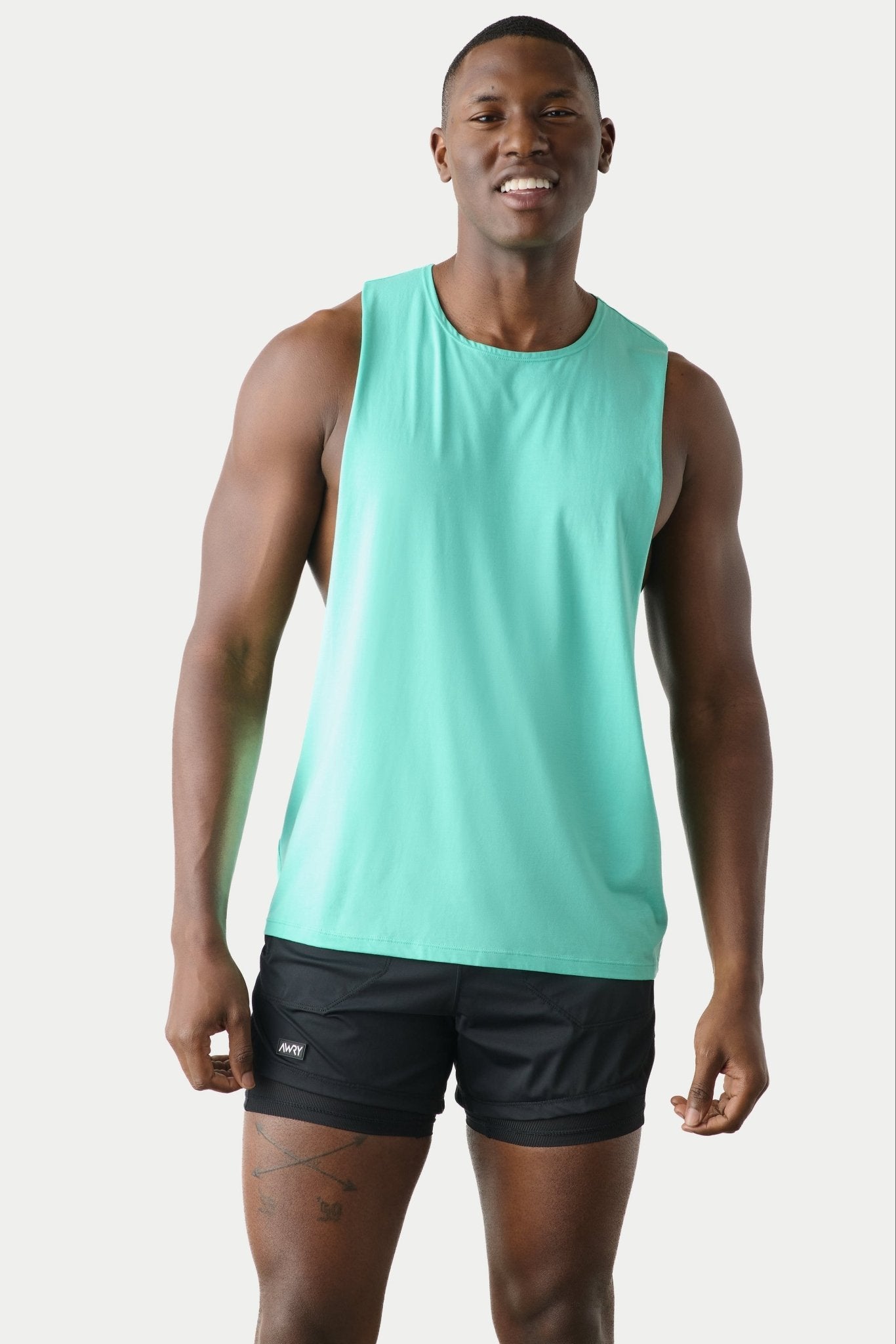 Awry Impact Tank Turquoise — men's cotton-modal activewear tank with deep side cutouts, front view