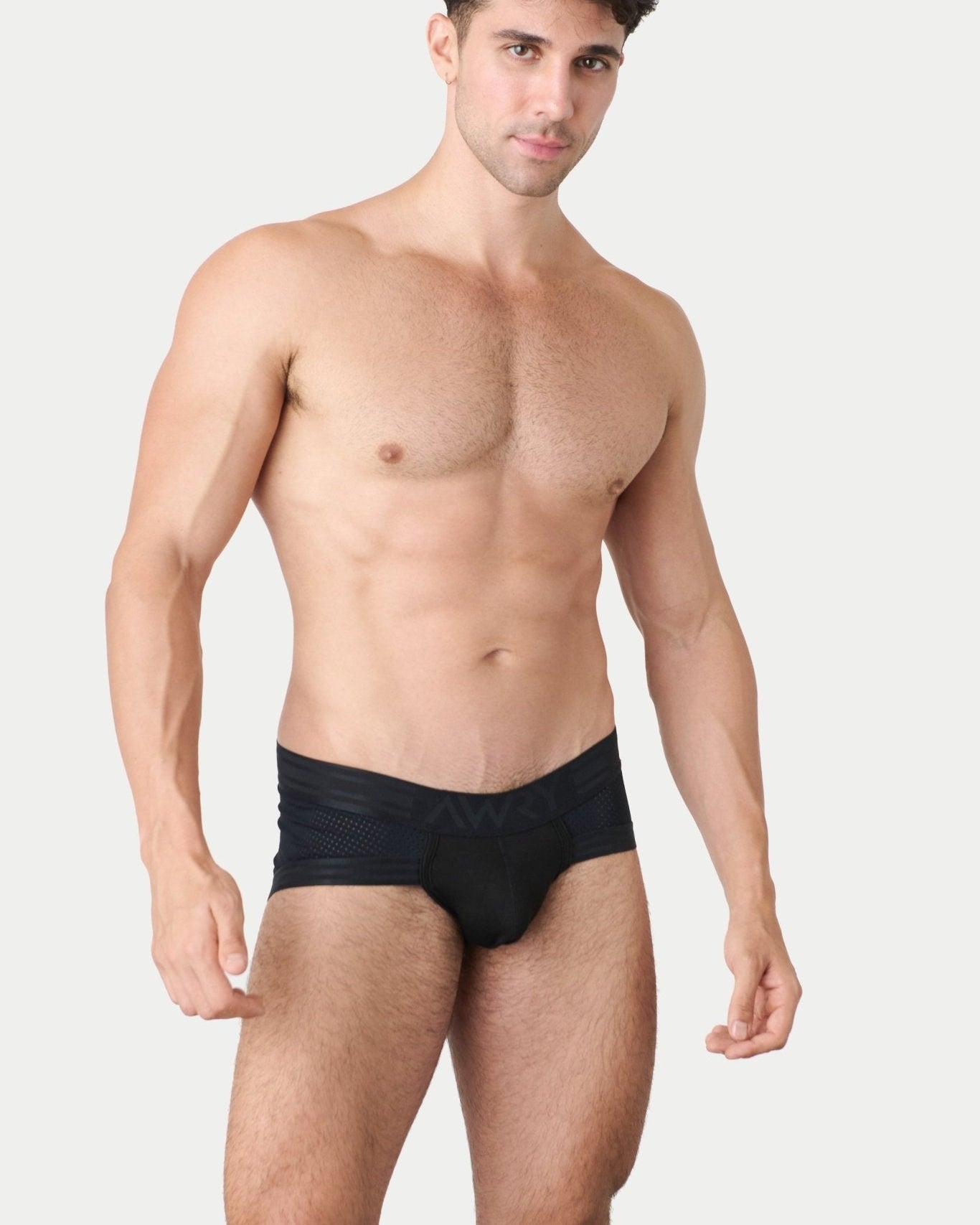 Awry Lift Brief Black — detail shot of branded waistband and 4-way stretch mesh fabric