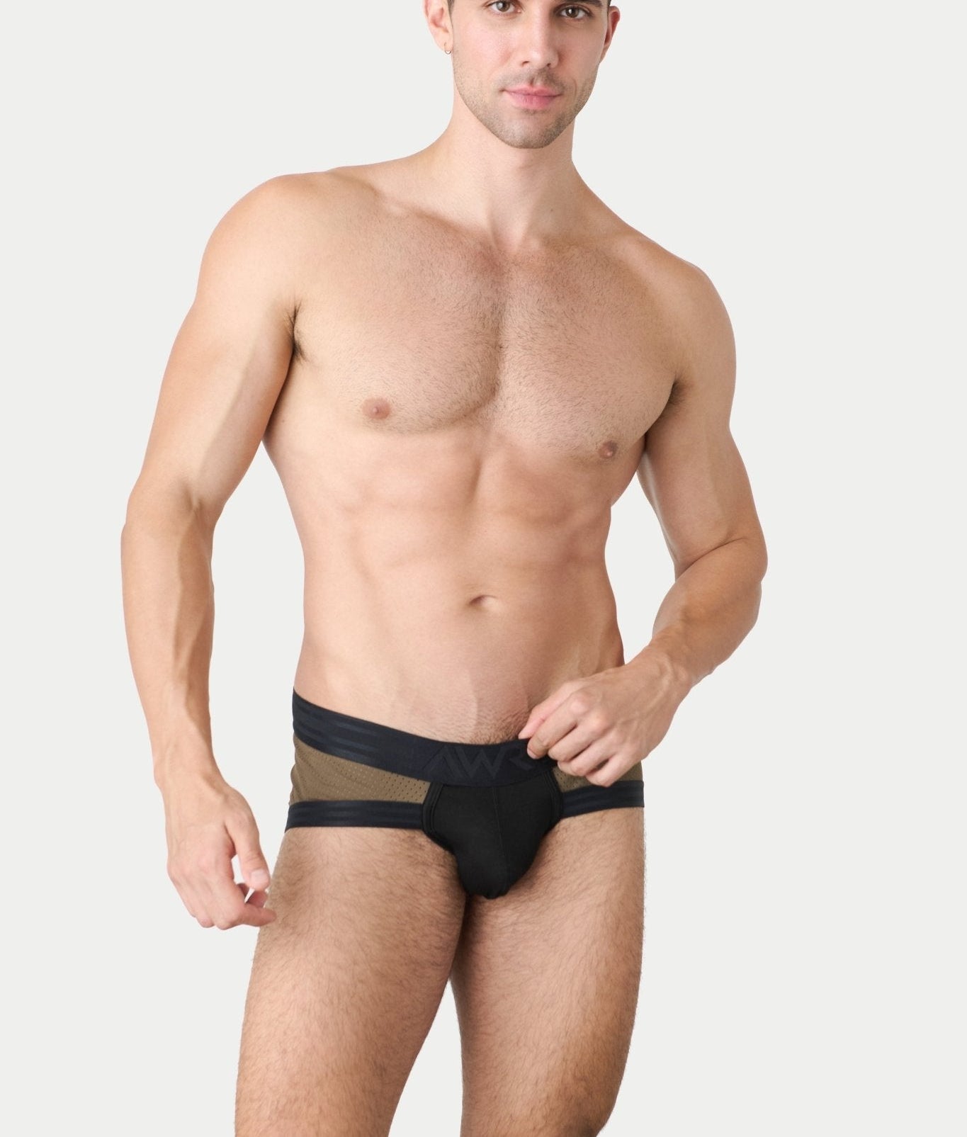 Awry Lift Brief Moss Black - front view showing moss green mesh and black waistband, model lifestyle shot
