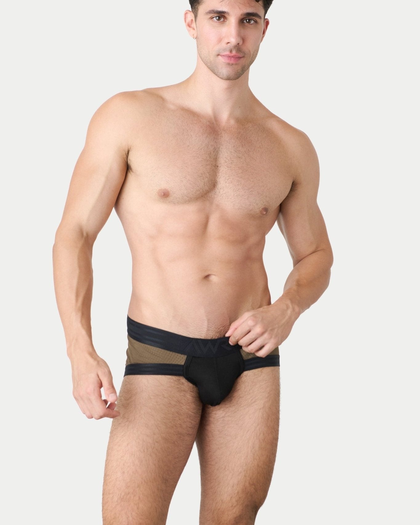 Awry Lift Brief Moss Black - front view showing moss green mesh and black waistband, model lifestyle shot