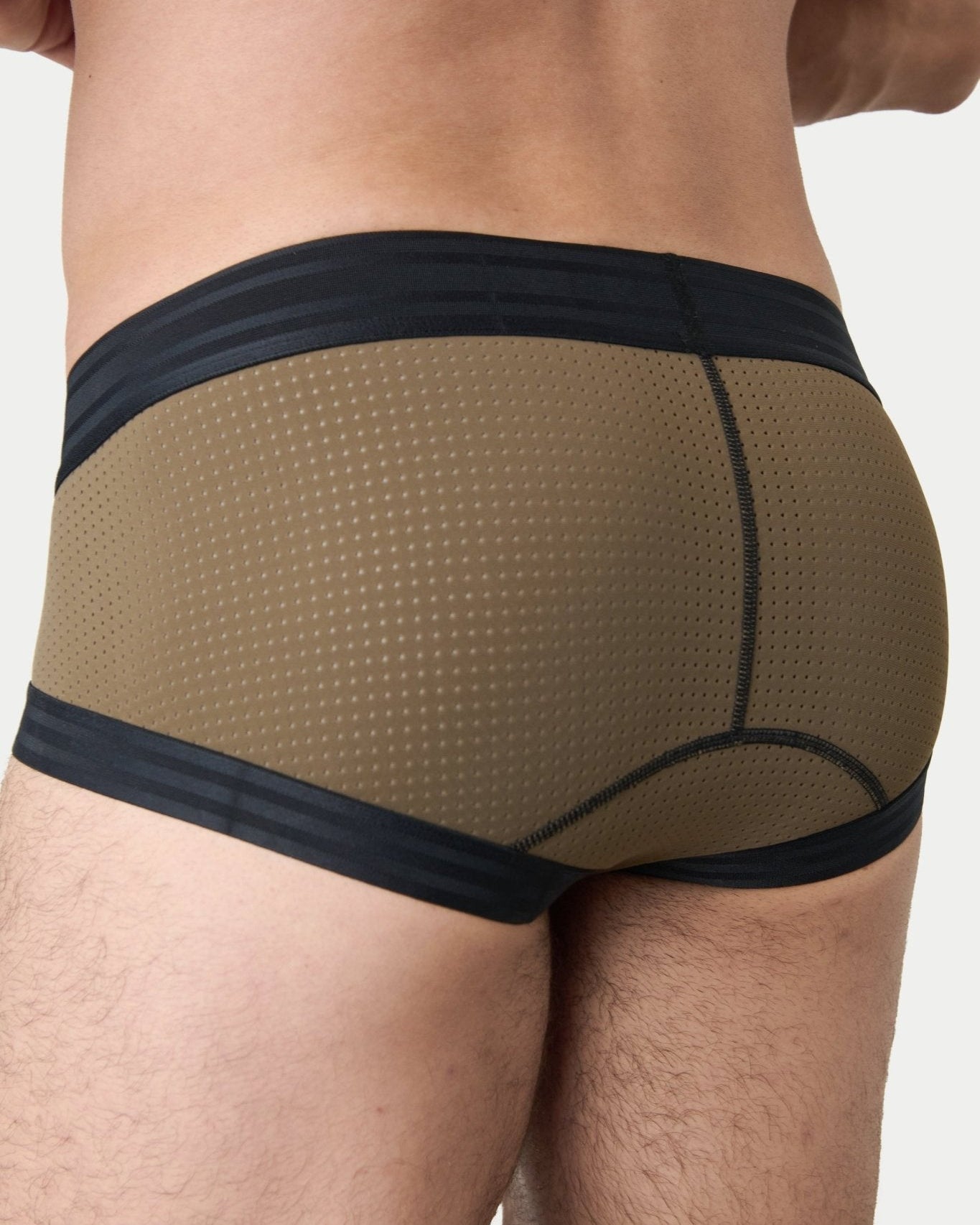 Awry Lift Brief Moss Black - side view showing low-rise silhouette and mesh panels