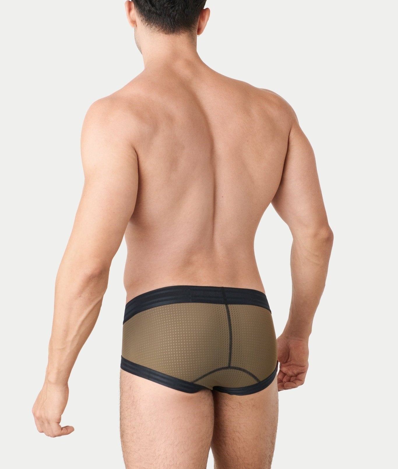 Awry Lift Brief Moss Black - men's enhancing brief back view, lifestyle shot