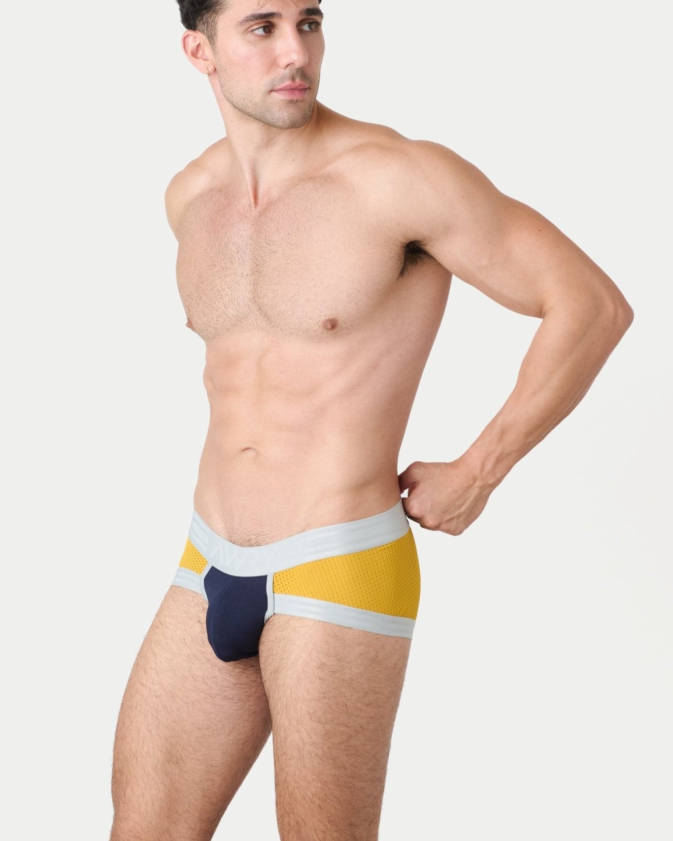 Awry Lift Brief Navy Gold — detail shot of branded waistband and 4-way stretch mesh fabric