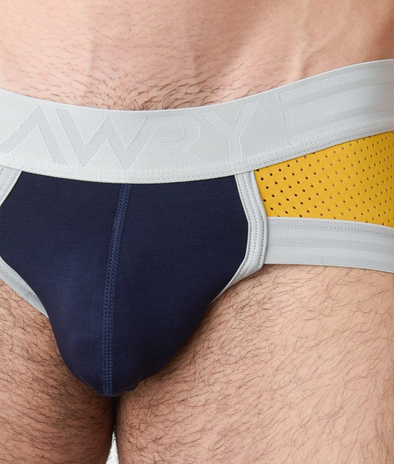 Awry Lift Brief Navy Gold — rear view showing built-in jockstrap strap system and lift construction