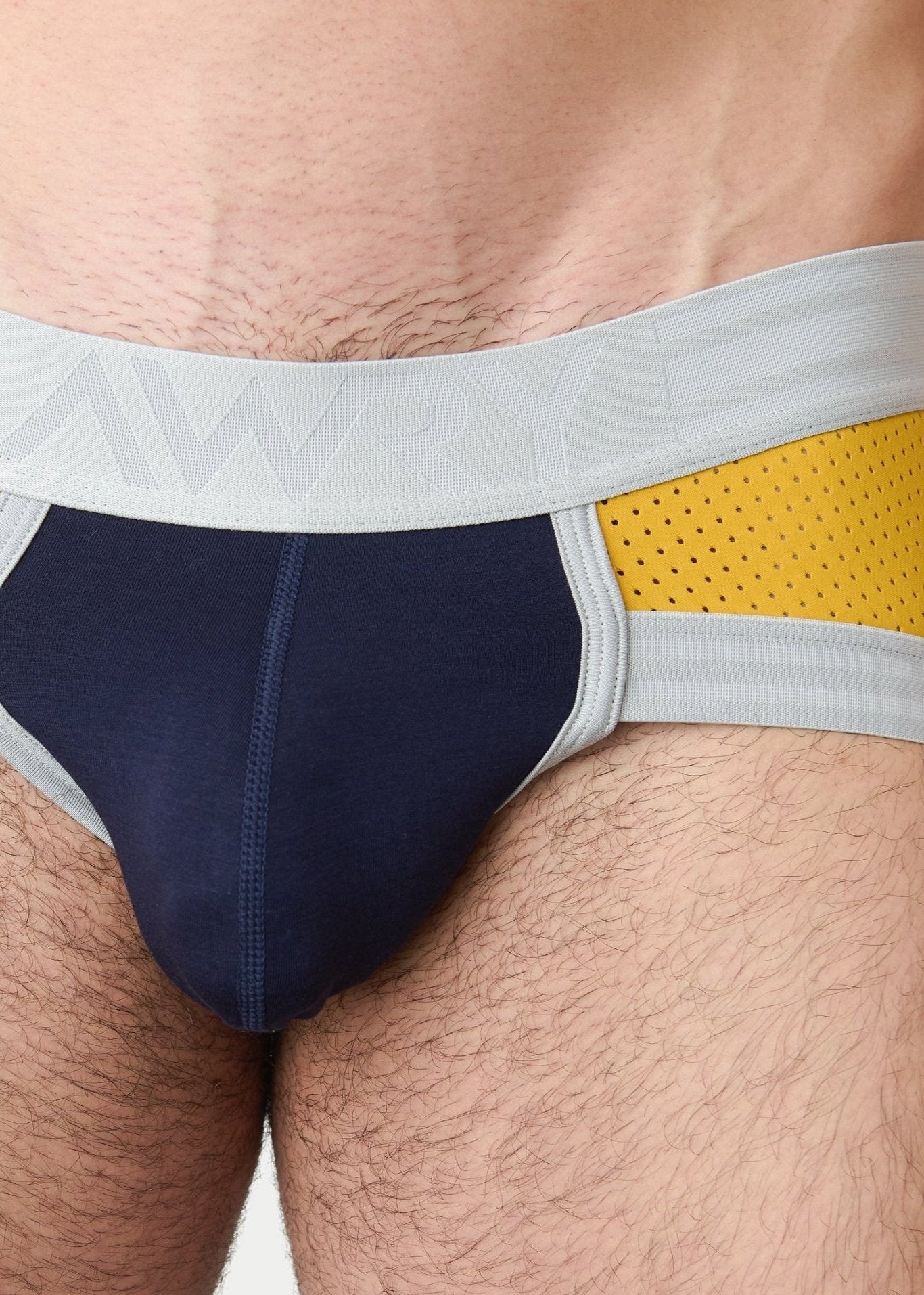 Awry Lift Brief Navy Gold — rear view showing built-in jockstrap strap system and lift construction