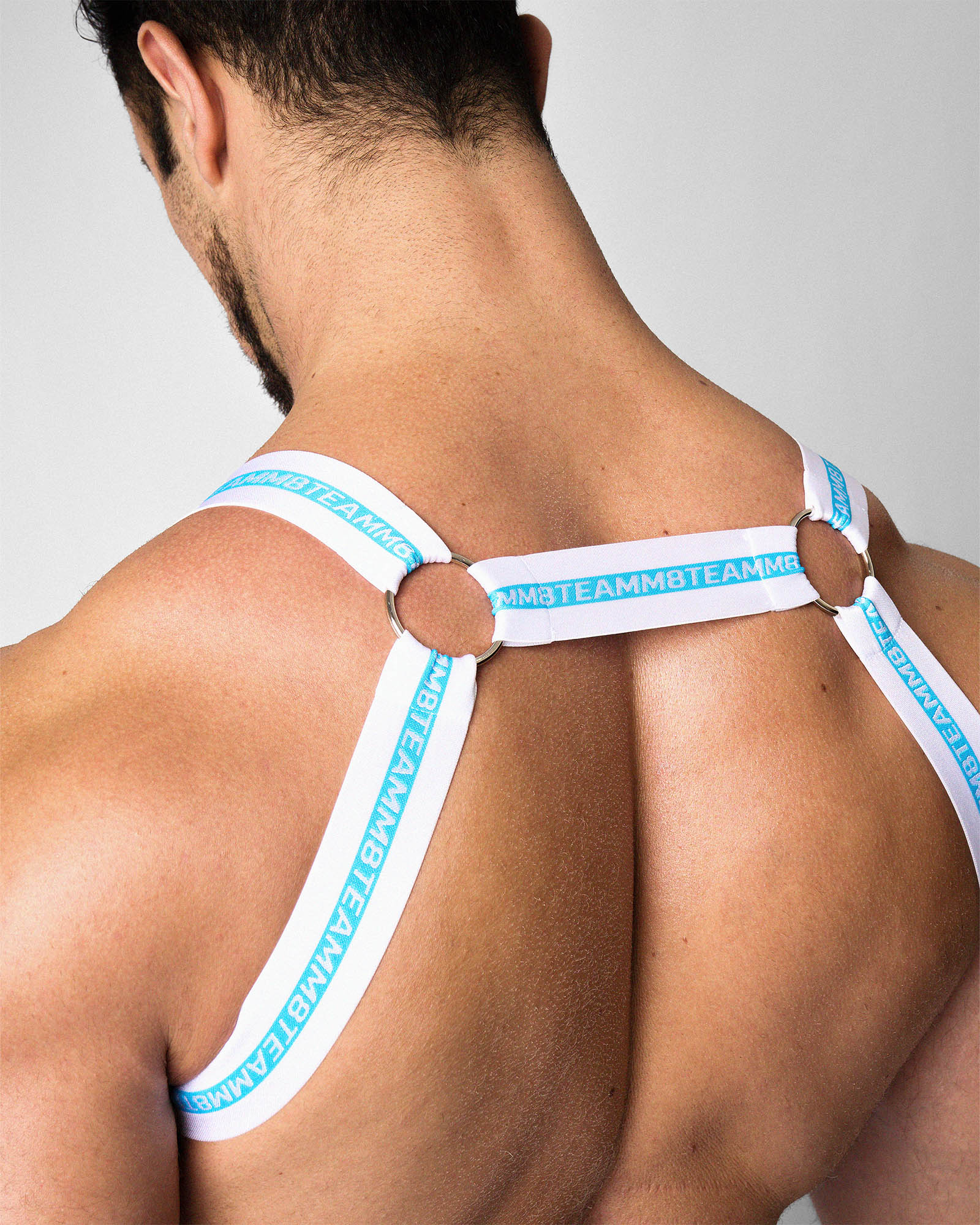 Teamm8 Optic Harness Azure — men's fashion harness with O-ring hardware, back view
