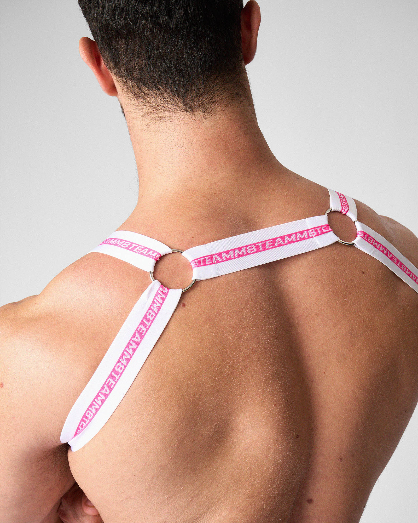 Teamm8 Optic Harness Fuchsia - men's stretch elastic harness with metal O-ring hardware, three-quarter view
