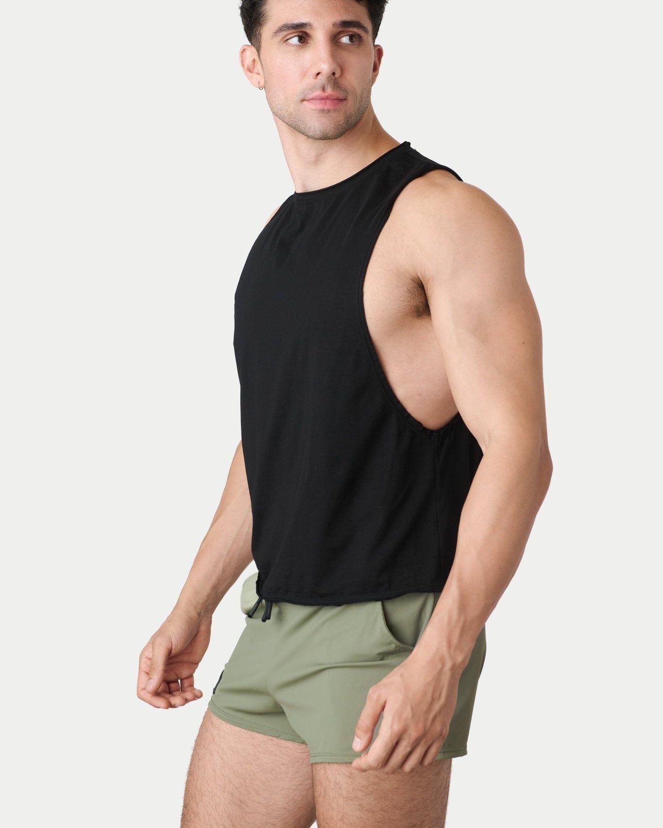 Awry Raw Crop Tank Black — close-up of raw unfinished edge at collar and armhole