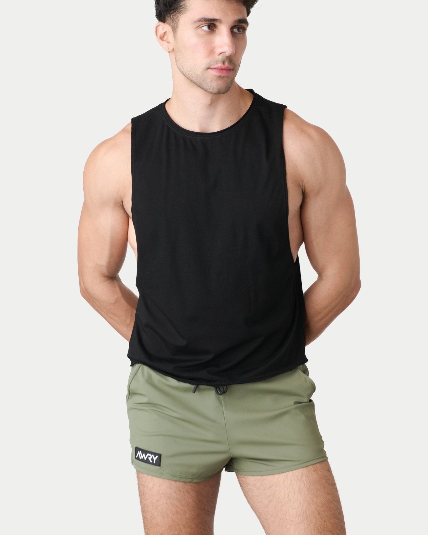 Awry Raw Crop Tank Black — rear view showing open back and raw hem edge detail