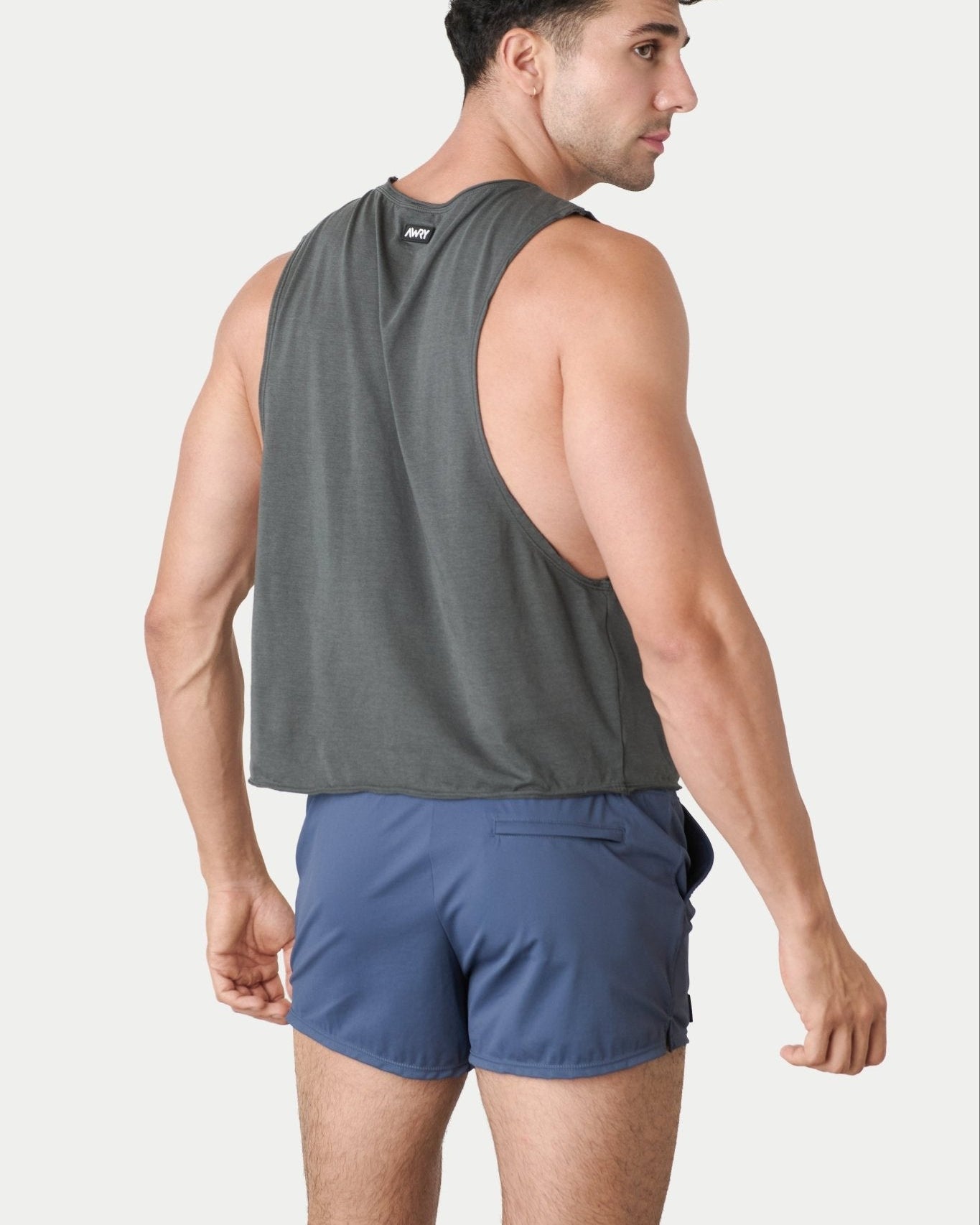 Awry Raw Crop Tank Charcoal — close-up of raw unfinished edge at collar and armhole