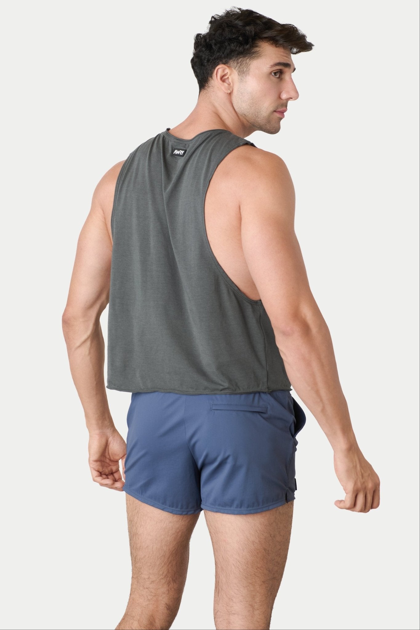 Awry Raw Crop Tank Charcoal — close-up of raw unfinished edge at collar and armhole