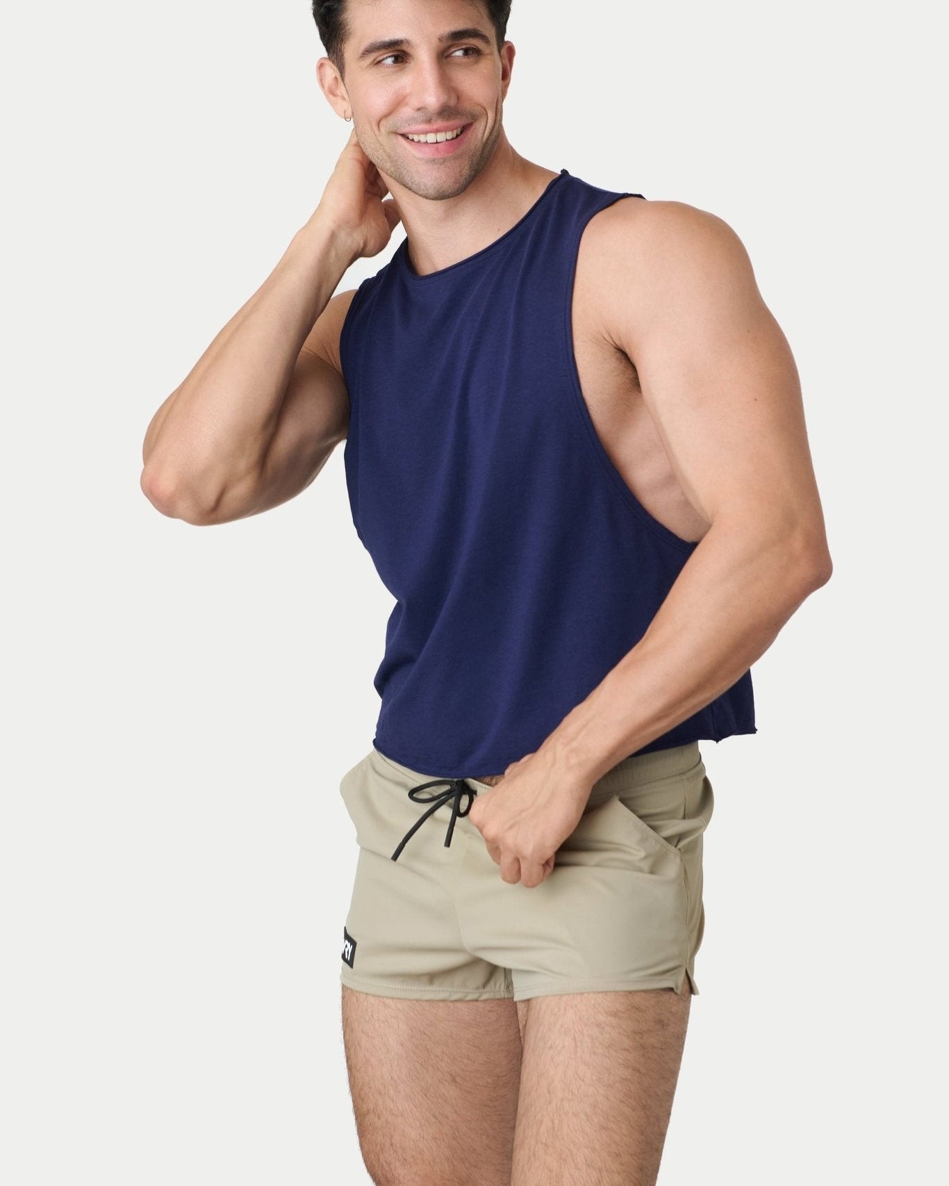 Awry Raw Crop Tank Navy — rear view showing open back and raw hem edge detail