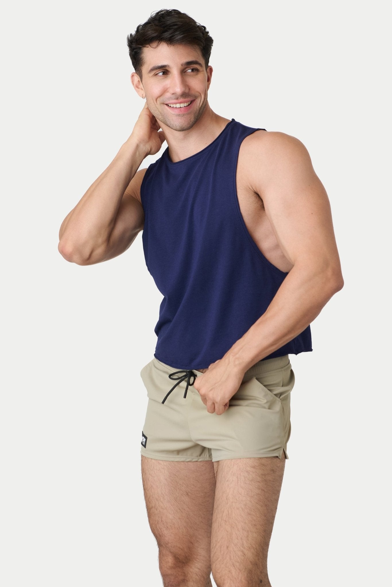 Awry Raw Crop Tank Navy — rear view showing open back and raw hem edge detail