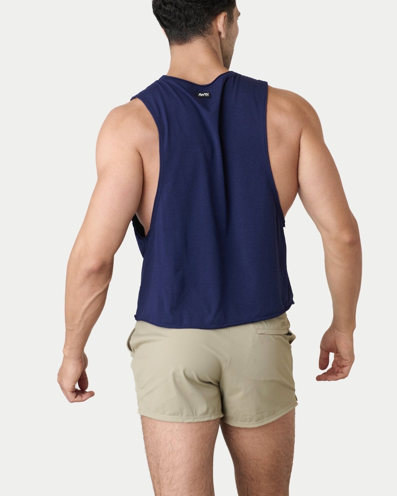 Awry Raw Crop Tank Navy — close-up of raw unfinished edge at collar and armhole