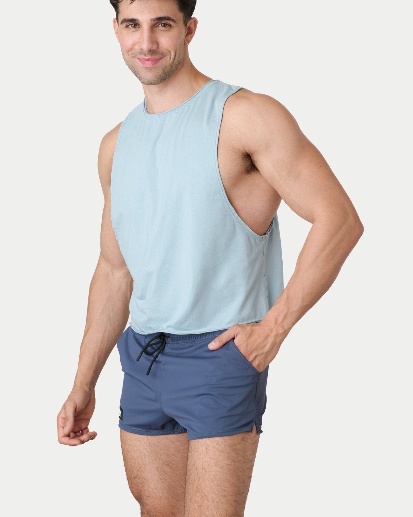 Awry Raw Crop Tank Soft Blue — side view showing cropped midriff-exposing silhouette