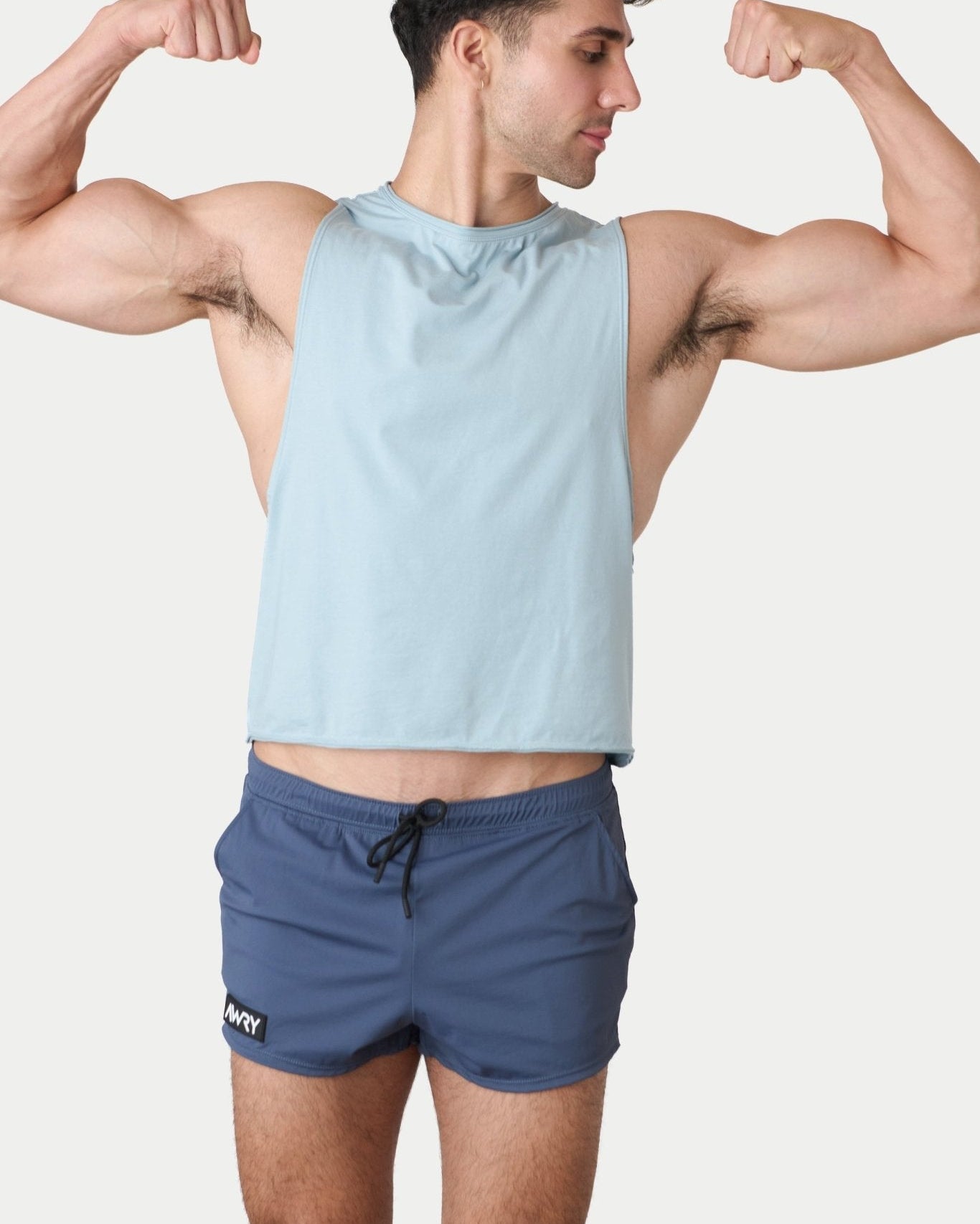 Awry Raw Crop Tank Soft Blue — rear view showing open back and raw hem edge detail