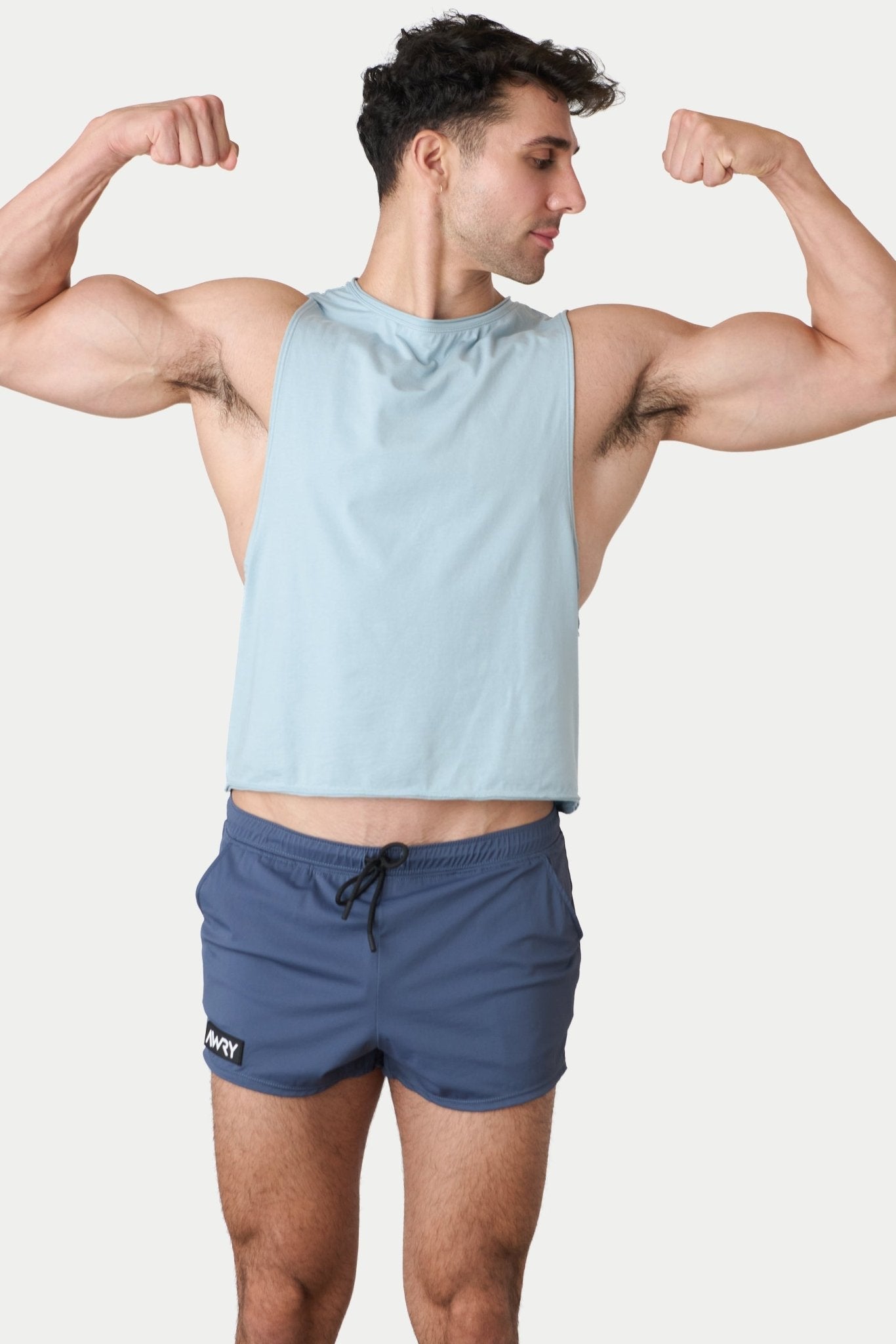 Awry Raw Crop Tank Soft Blue — rear view showing open back and raw hem edge detail