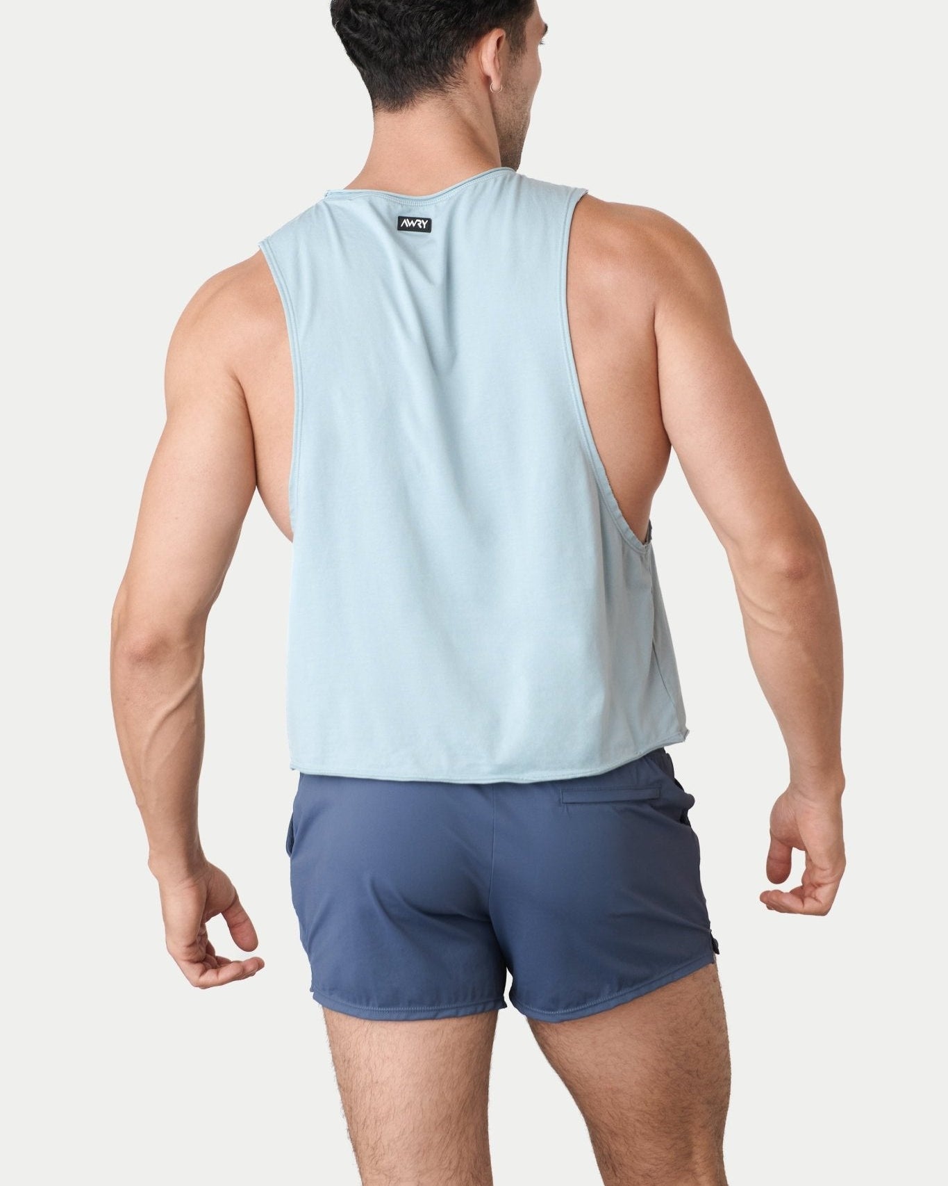 Awry Raw Crop Tank Soft Blue — close-up of raw unfinished edge at collar and armhole