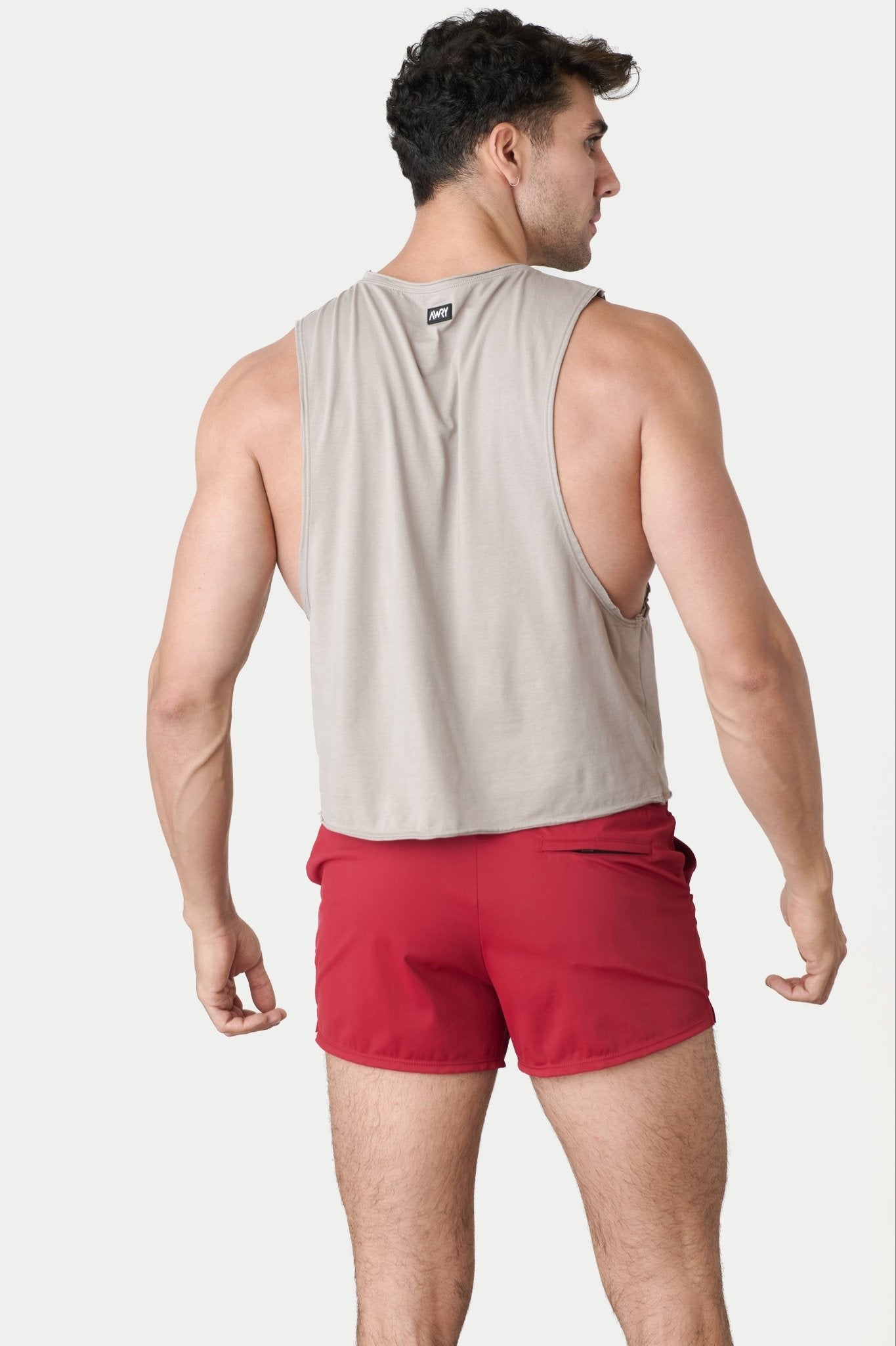 Awry Raw Crop Tank Taupe — close-up of raw unfinished edge at collar and armhole