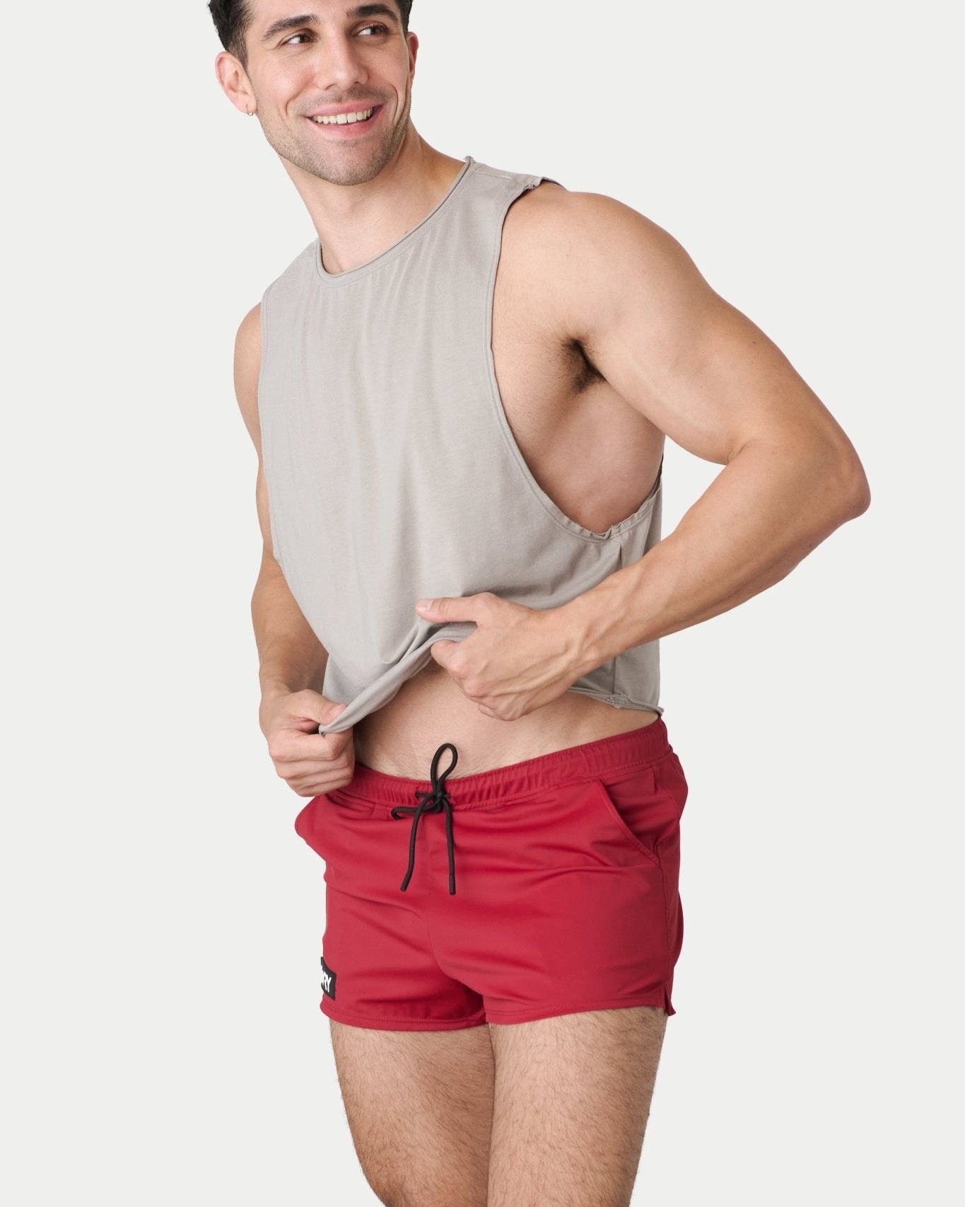 Awry Raw Crop Tank Taupe — side view showing cropped midriff-exposing silhouette