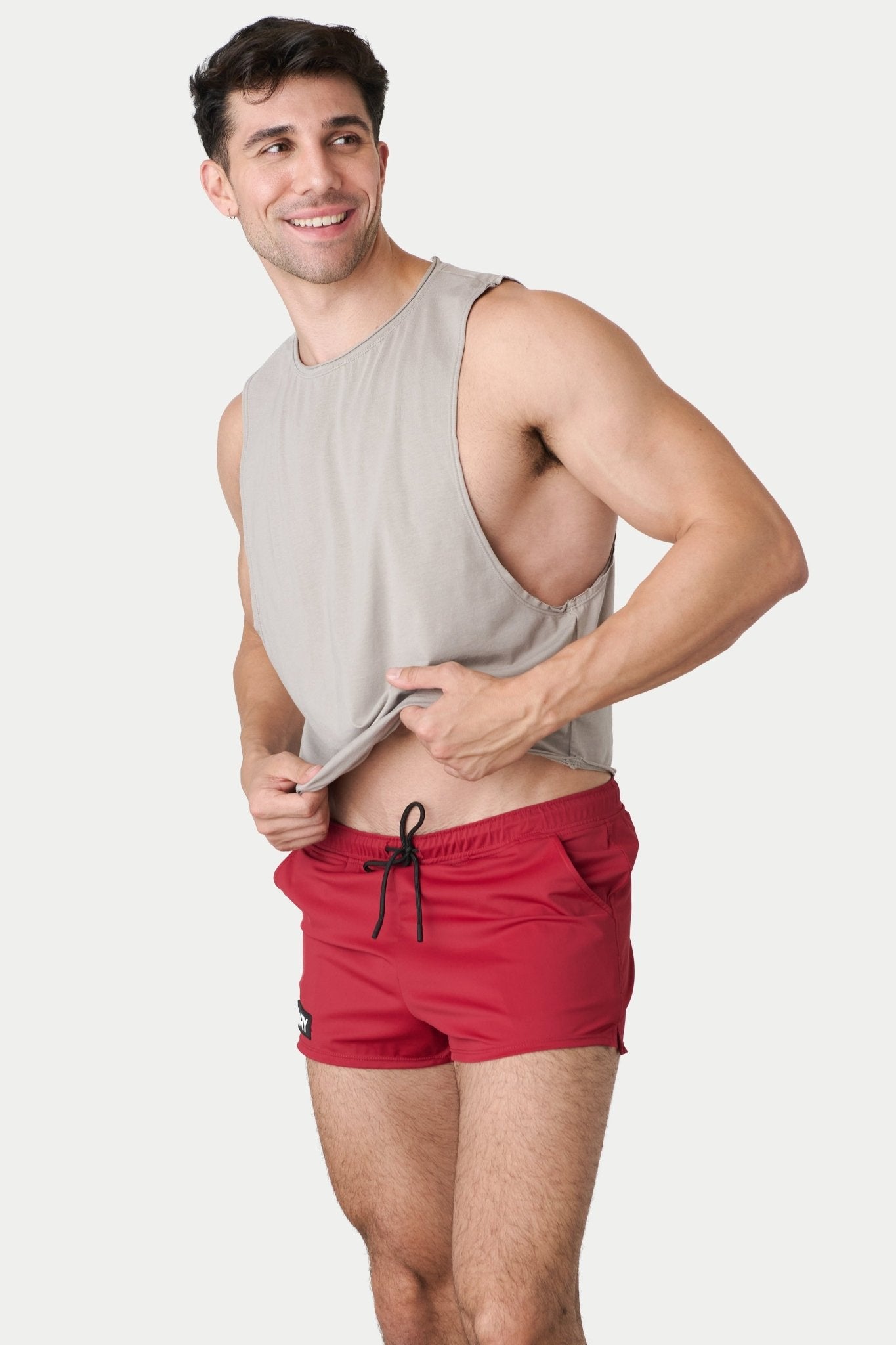 Awry Raw Crop Tank Taupe — side view showing cropped midriff-exposing silhouette