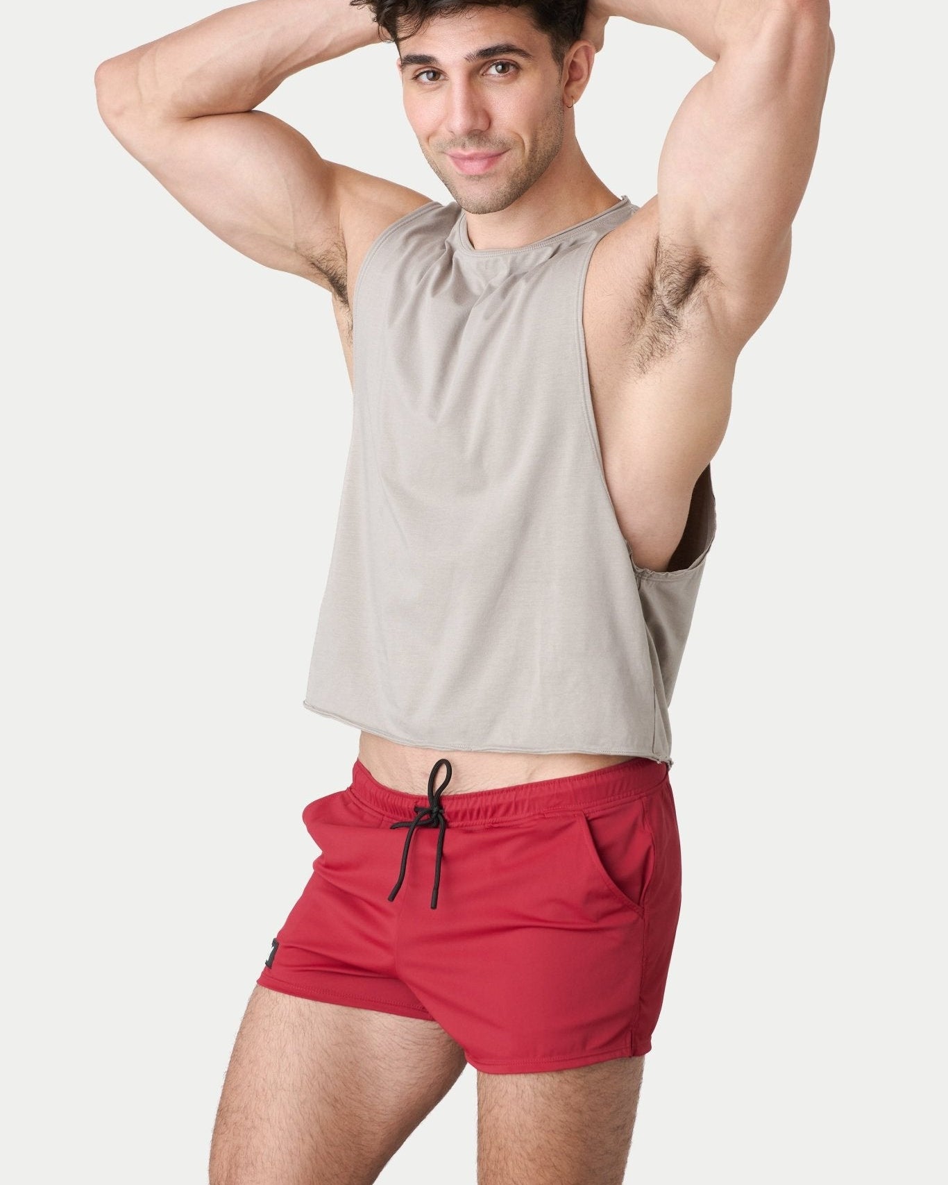 Awry Raw Crop Tank Taupe — rear view showing open back and raw hem edge detail