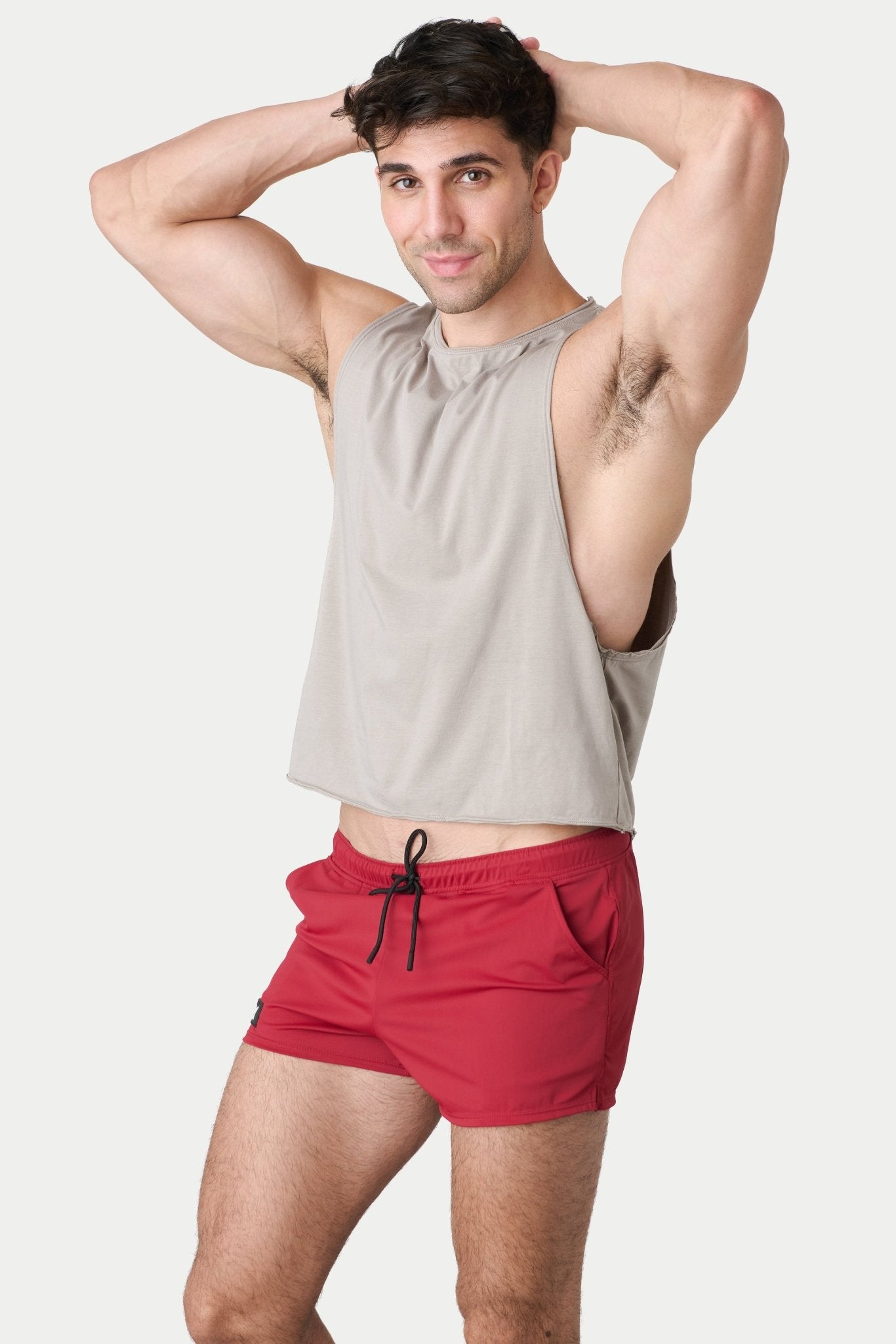 Awry Raw Crop Tank Taupe — rear view showing open back and raw hem edge detail