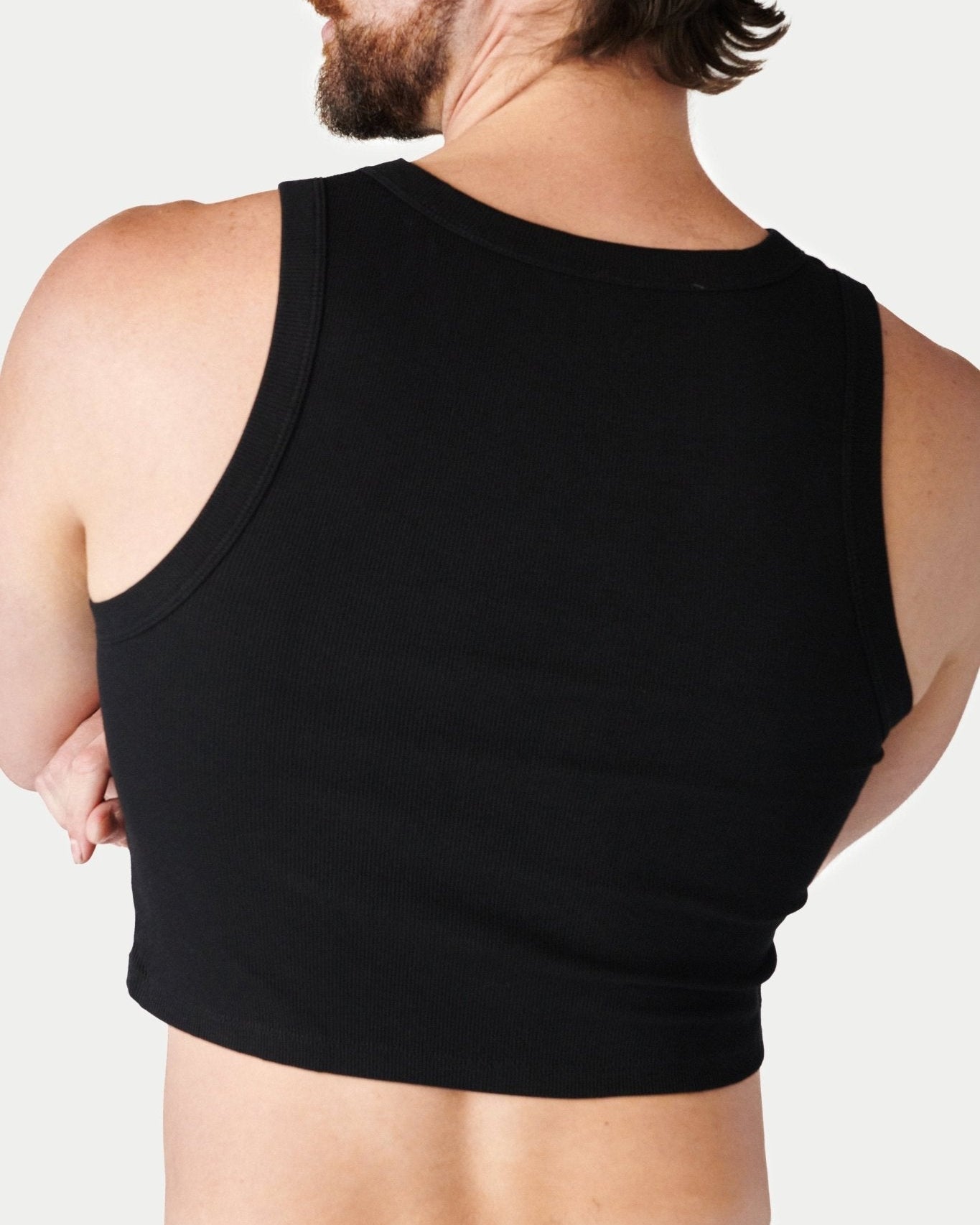 Awry Ribbed Crop Tank Black — close-up of ribbed knit texture and hip-length crop detail