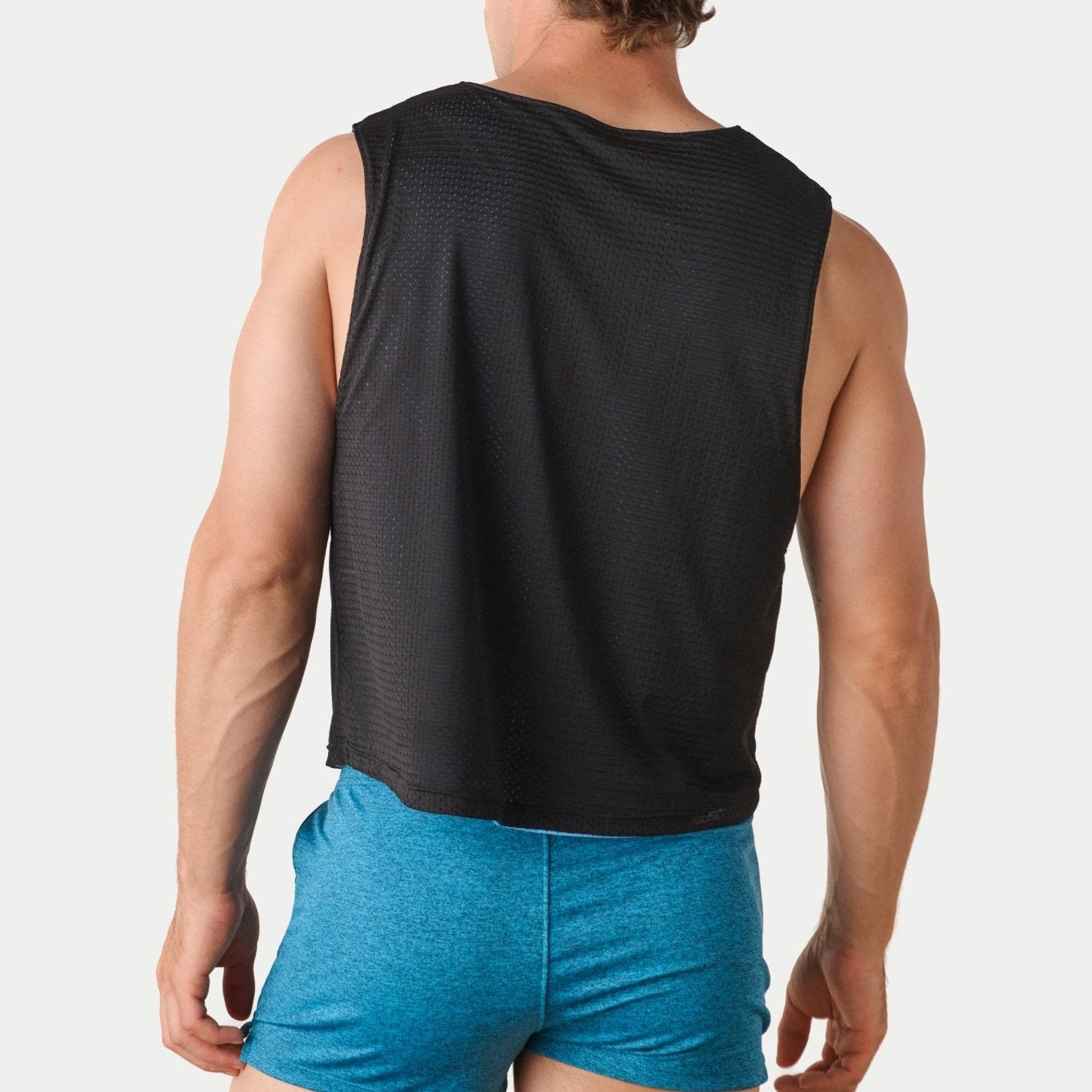 Awry Rookie Reversible Tank Black & Blue — side view showing semi-cropped silhouette and mesh construction