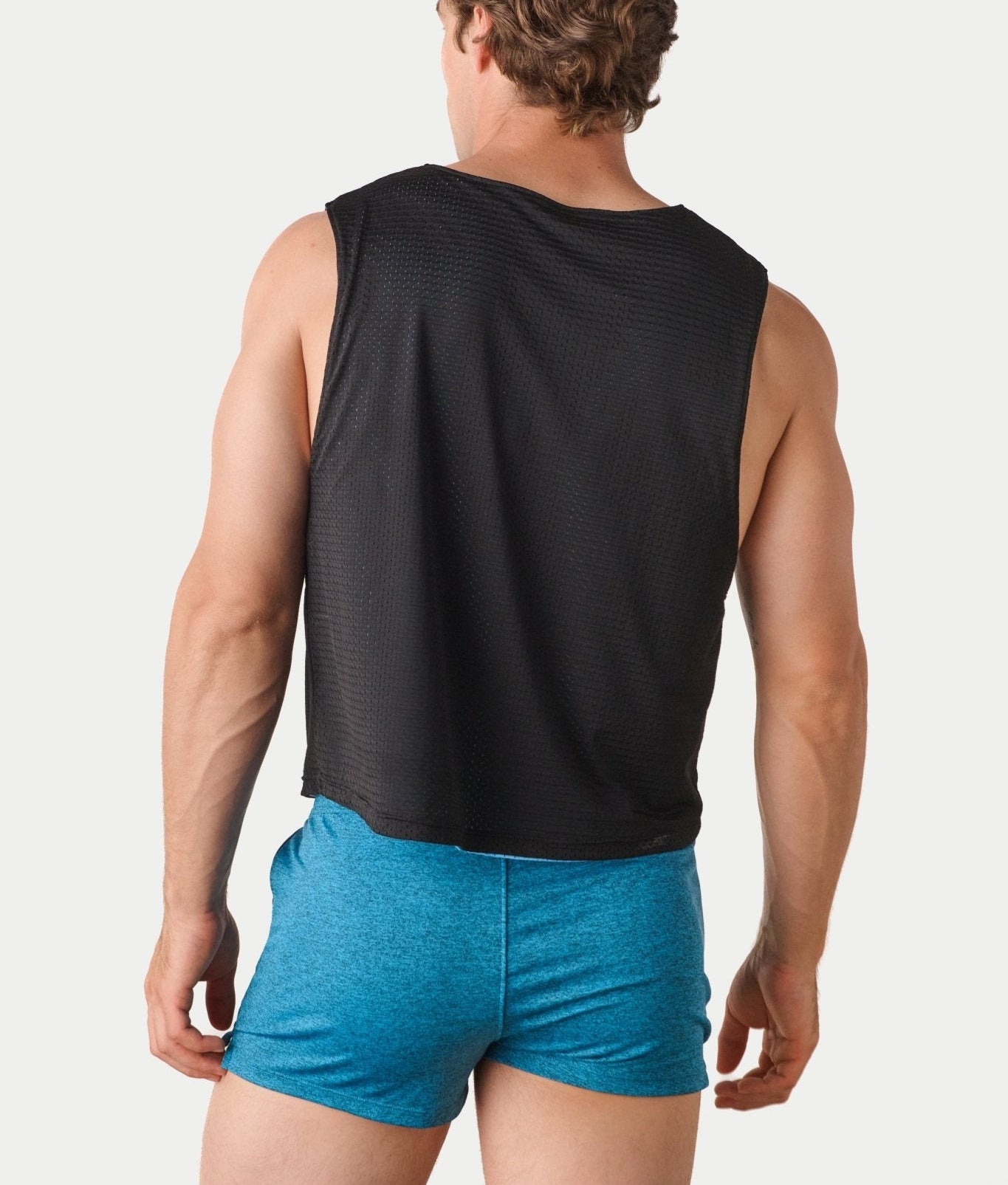 Awry Rookie Reversible Tank Black & Blue — side view showing semi-cropped silhouette and mesh construction