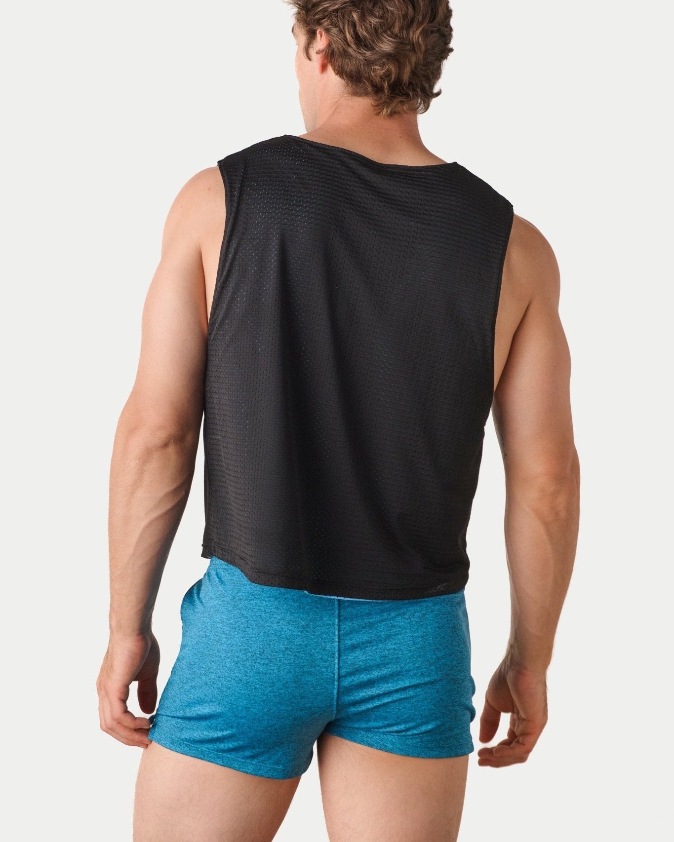 Awry Rookie Reversible Tank Black & Blue — side view showing semi-cropped silhouette and mesh construction