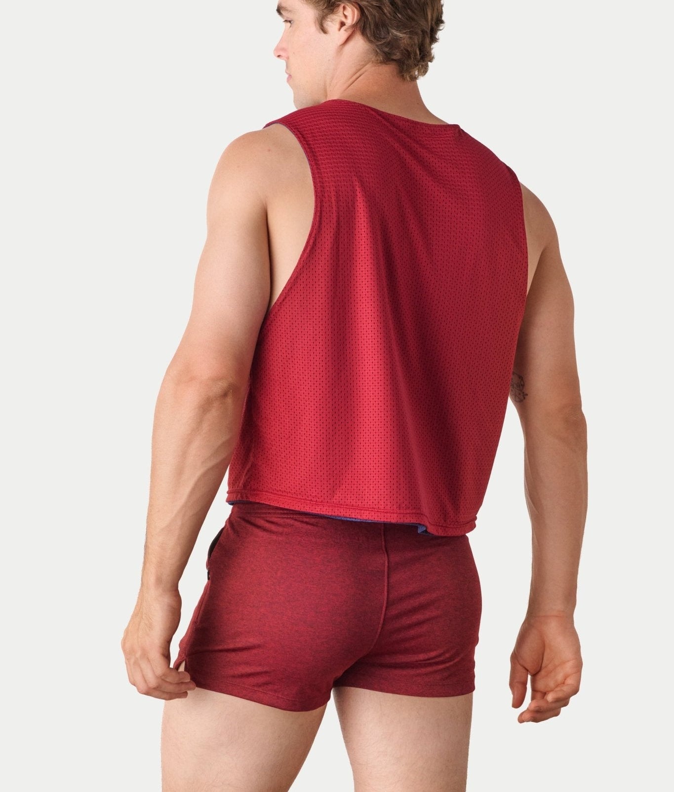 Awry Rookie Reversible Tank Navy & Red — side view showing semi-cropped silhouette and mesh construction